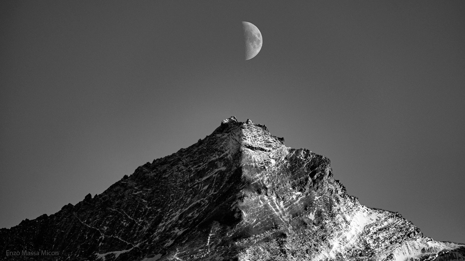 Can the Moon and a mountain really cast similar shadows? Yes, but the division between light and dark does not have to be aligned. Pictured, a quarter moon was captured above the mountain Grivola in Italy in early October of 2022.  The Sun is to the right of the featured picturesque landscape, illuminating the right side of the Moon in a similar way that it illuminates the right side of the mountain. This lunar phase is called "quarter", in part, because the lit fraction visible from Earth is one quarter of the entire lunar surface.  Digital post-processing of this single exposure gave both  gigantic objects more prominence. Capturing the terminator of this quarter moon in close alignment with nearly vertical mountain ridge required careful timing because the Earth rotates once a day.