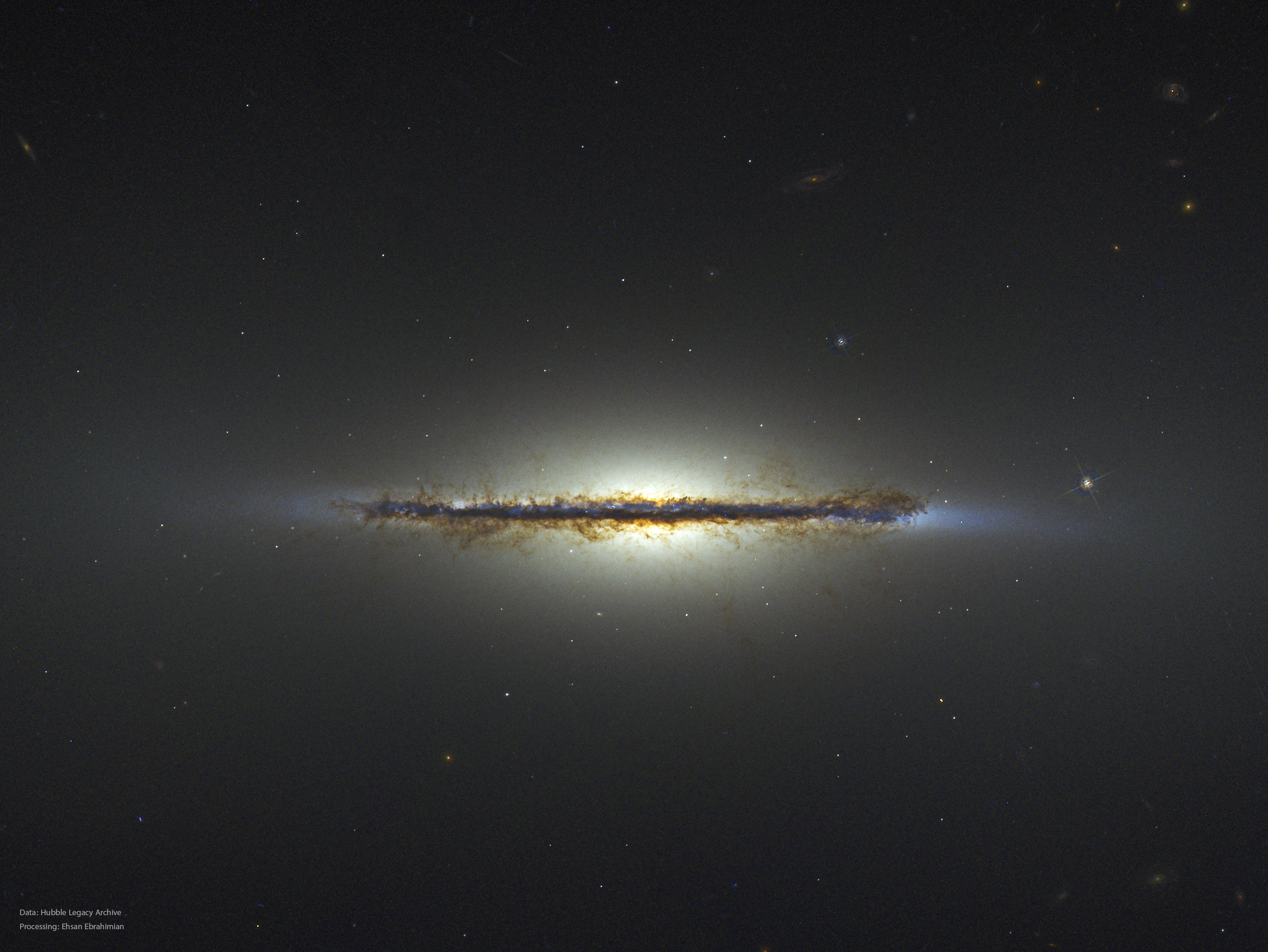 What kind of celestial object is this? A relatively normal galaxy -- but seen from its edge.  Many disk galaxies are actually just as thin as NGC 5866, the Spindle galaxy, pictured here, but are not seen edge-on from our vantage point.  A perhaps more familiar galaxy seen edge-on is our own Milky Way galaxy.  Also cataloged as M102, the Spindle galaxy has numerous and complex dust lanes appearing dark and red, while many of the bright stars in the disk give it a more blue underlying hue.  The blue disk of young stars can be seen in this Hubble image extending past the dust in the extremely thin galactic plane. There is evidence that the Spindle galaxy has cannibalized smaller galaxies over the past billion years or so, including multiple streams of faint stars, dark dust that extends away from the main galactic plane, and a surrounding group of galaxies (not shown).  In general, many disk galaxies become thin because the gas that forms them collides with itself as it rotates about the gravitational center. The Spindle galaxy lies about 50 million light years distant toward the constellation of the Dragon (Draco).