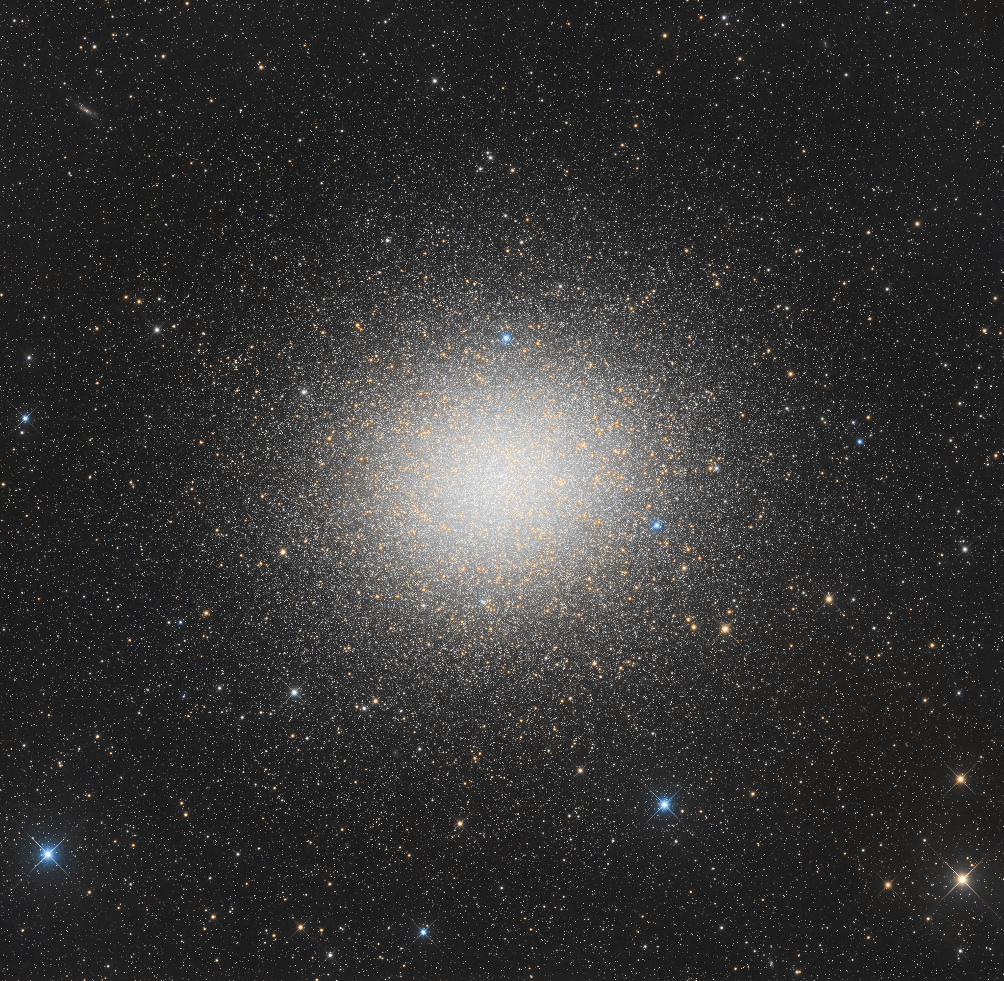 Globular star cluster Omega Centauri, also known as NGC 5139, is 15,000 light-years away. The cluster is packed with about 10 million stars much older than the Sun within a volume about 150 light-years in diameter. It's the largest and brightest of 200 or so known globular clusters that roam the halo of our Milky Way galaxy. Though most star clusters consist of stars with the same age and composition, the enigmatic Omega Cen exhibits the presence of different stellar populations with a spread of ages and chemical abundances. In fact, Omega Cen may be the remnant core of a small galaxy merging with the Milky Way. With a yellowish hue, Omega Centauri's red giant stars are easy to pick out in this sharp, color telescopic view.