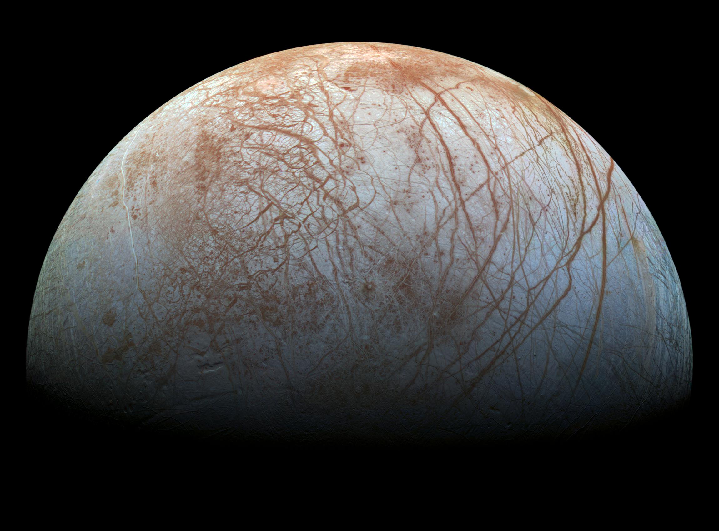 Looping through the Jovian system in the late 1990s, the Galileo spacecraft recorded stunning views of Europa and uncovered evidence that the moon's icy surface likely hides a deep, global ocean. Galileo's Europa image data has been remastered here, with improved calibrations to produce a color image approximating what the human eye might see. Europa's long curving fractures hint at the subsurface liquid water.  The tidal flexing the large moon experiences in its elliptical orbit around Jupiter supplies the energy to keep the ocean liquid. But more tantalizing is the possibility that even in the absence of sunlight that process could also supply the energy to support life, making Europa one of the best places to look for life beyond Earth. The Juno spacecraft currently in Jovian orbit has also made repeated flybys of the water world, returning images along with data exploring Europa's habitability. This October will see the launch of the NASA's Europa Clipper on a voyage of exploration. The spacecraft will make nearly 50 flybys, approaching to within 25 kilometers of Europa's icy surface.