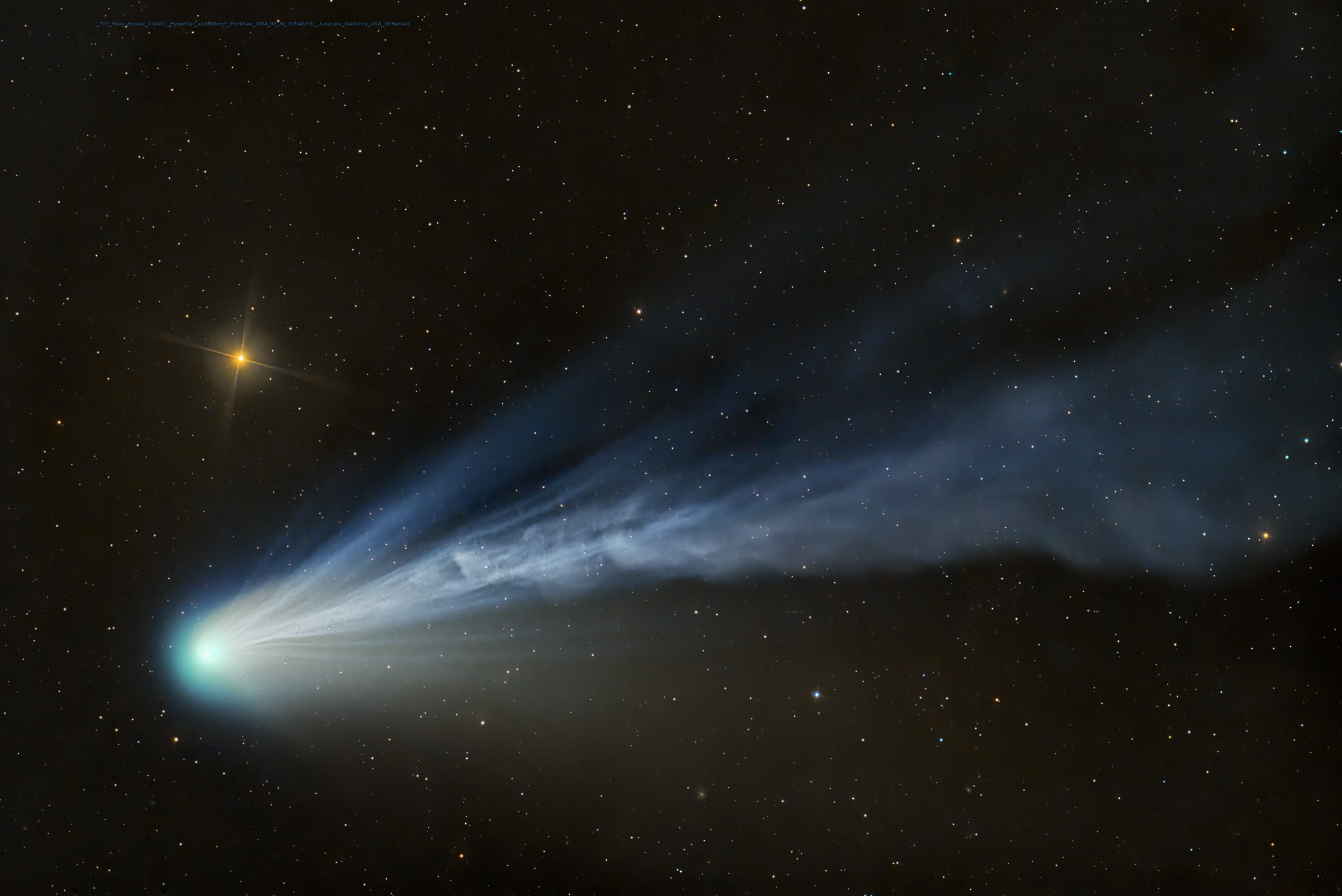 In dark evening skies over June Lake, northern hemisphere, planet Earth, Comet 12P/Pons-Brooks stood just above the western horizon on March 30. Its twisted turbulent ion tail and diffuse greenish coma are captured in this two degree wide telescopic field of view along with bright yellowish star Hamal also known as Alpha Arietis. Now Pons-Brooks has moved out of the northern night though, approaching perihelion on April 21. On April 8 you might still spot the comet in daytime skies. But to do it, you will have to stand in the path of totality and look away from the spectacle of an alluring solar corona and totally eclipsed Sun.   NASA Coverage: Total Solar Eclipse of 2024 April 8