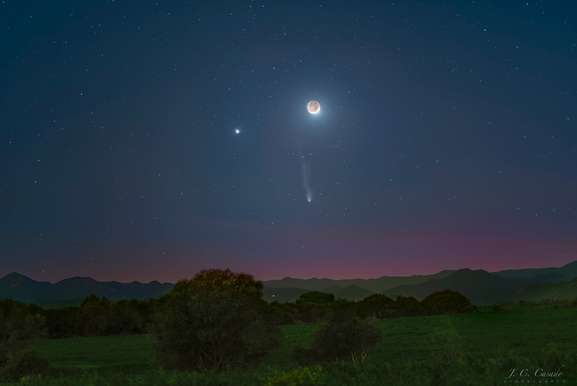 Three bright objects satisfied seasoned stargazers of the western sky just after sunset earlier this month. The most familiar was the Moon, seen on the upper left in a crescent phase. The rest of the Moon was faintly visible by sunlight first reflected by the Earth. The bright planet Jupiter, the largest planet in the Solar System, is seen to the upper left.  Most unusual was Comet 12P/Pons-Brooks, below the Moon and showing a stubby dust tail on the right but an impressive ion tail extending upwards.  The featured image, a composite of several images taken consecutively at the same location and with the same camera, was taken near the village of Llers, in Spain's Girona province.  Comet Pons-Brooks passed its closest to the Sun last week and is now dimming as it moves into southern skies and returns to the outer Solar System.   Almost Hyperspace: Random APOD Generator