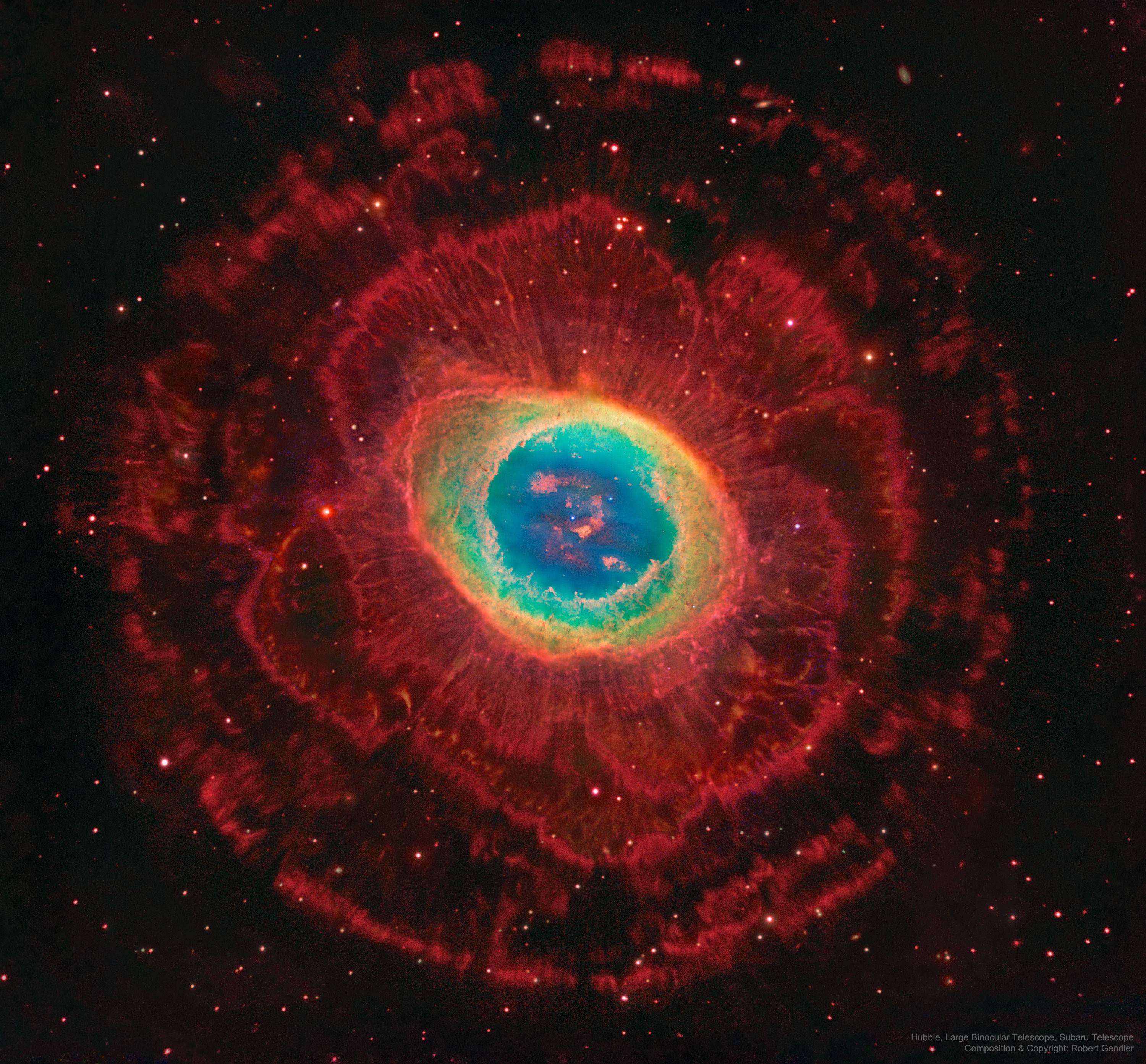 The Ring Nebula (M57) is more complicated than it appears through a small telescope.  The easily visible central ring is about one light-year across, but this remarkably deep exposure - a collaborative effort combining data from three different large telescopes - explores the looping filaments of glowing gas extending much farther from the nebula's central star. This composite image includes red light emitted by hydrogen as well as visible and infrared light. The Ring Nebula is an elongated planetary nebula, a type of nebula created when a Sun-like star evolves to throw off its outer atmosphere and become a white dwarf star.  The Ring Nebula is about 2,500 light-years away toward the musical constellation Lyra.   Your Sky Surprise: What picture did APOD feature on your birthday? (post 1995)