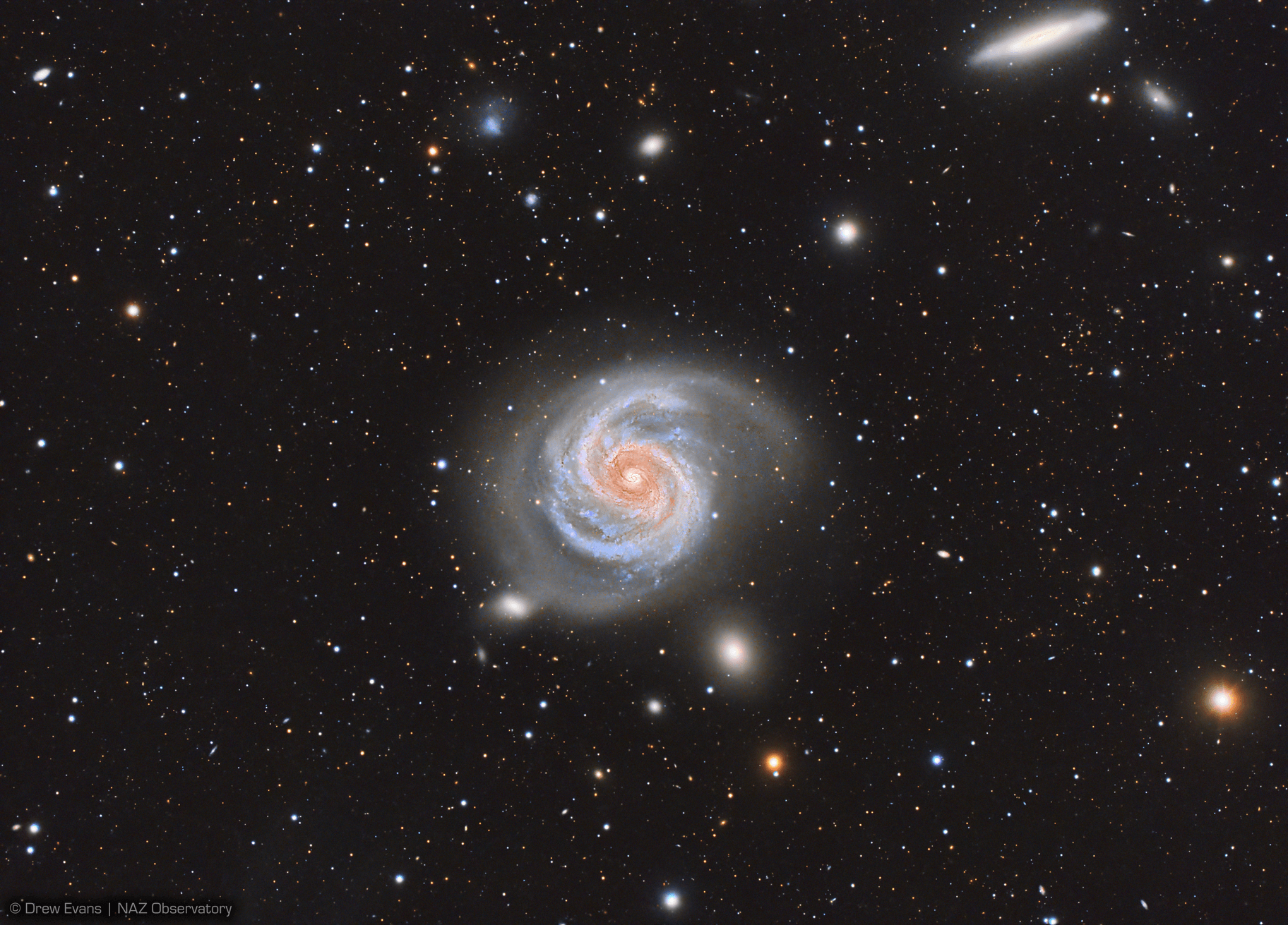 Majestic on a truly cosmic scale, M100 is appropriately known as a grand design spiral galaxy.  The large galaxy of over 100 billion stars has well-defined spiral arms, similar to our own Milky Way.  One of the brightest members of the Virgo Cluster of galaxies, M100, also known as NGC 4321 is 56 million light-years distant toward the well-groomed constellation Coma Berenices.  In this telescopic image, the face-on grand design spiral shares a nearly 1 degree wide field-of-view with slightly less conspicuous edge-on spiral NGC 4312 (at upper right). The 21 hour long equivalent exposure from a dark sky site near Flagstaff, Arizona, planet Earth, reveals M100's bright blue star clusters and intricate winding dust lanes which are hallmarks of this class of galaxies.  Measurements of variable stars in M100 have played an important role in determining the size and age of the Universe.