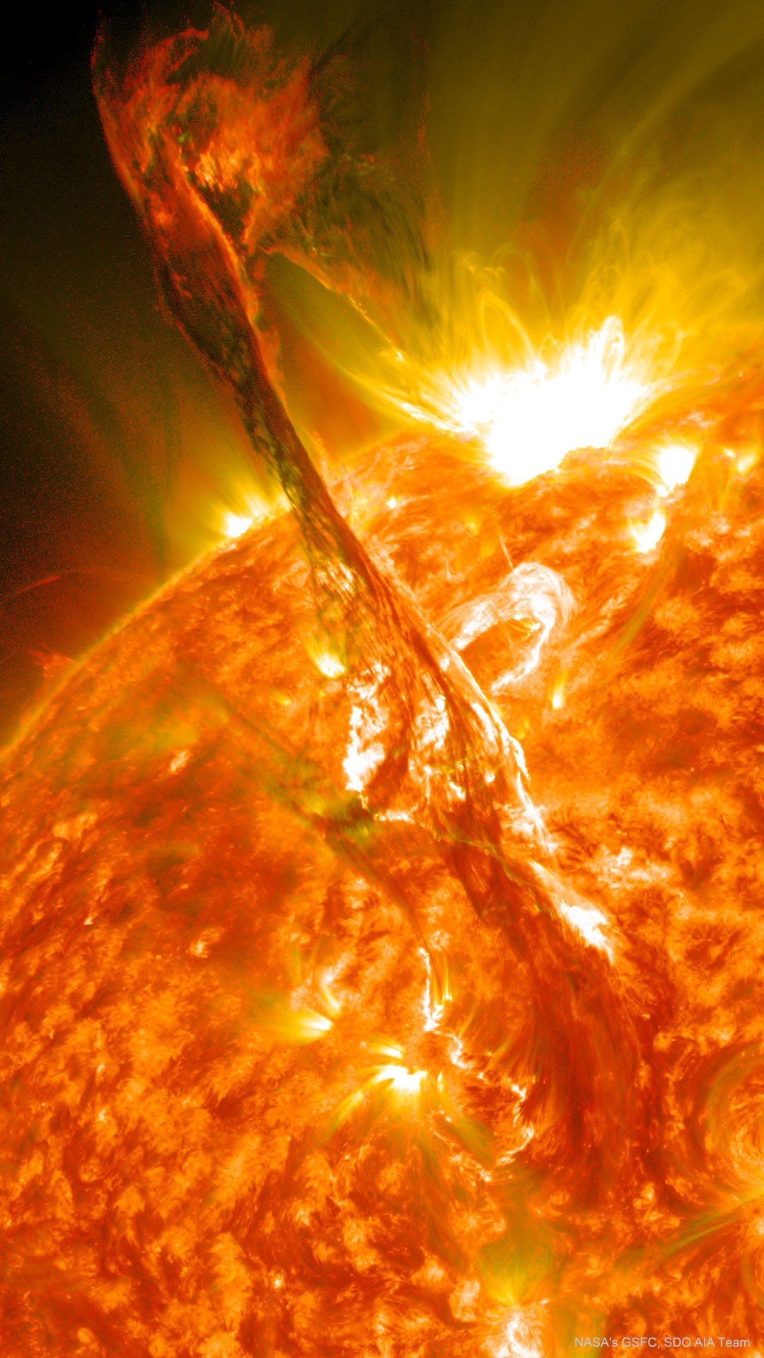 What's happened to our Sun?  Nothing very unusual -- it just threw a filament. Toward the middle of 2012, a long standing solar filament suddenly erupted into space, producing an energetic coronal mass ejection (CME).  The filament had been held up for days by the Sun's ever changing magnetic field and the timing of the eruption was unexpected. Watched closely by the Sun-orbiting Solar Dynamics Observatory, the resulting explosion shot electrons and ions into the Solar System, some of which arrived at Earth three days later and impacted Earth's magnetosphere, causing visible auroras. Loops of plasma surrounding the active region can be seen above the erupting filament in the featured ultraviolet image. Our Sun is nearing the most active time in its 11-year cycle, creating many coronal holes that allow for the ejection of charged particles into space. As before, these charged particles can create auroras.    Your Sky Surprise: What picture did APOD feature on your birthday? (post 1995)