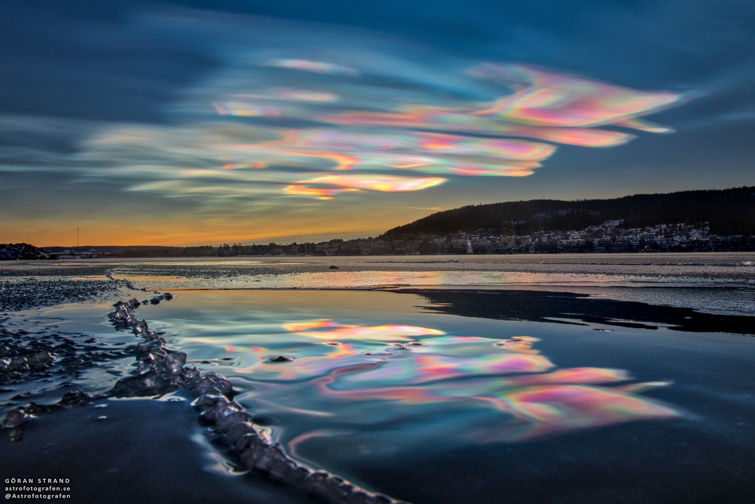 Why are these clouds multi-colored?  A relatively rare phenomenon in clouds known as iridescence can bring up unusual colors vividly -- or even a whole spectrum of colors simultaneously. These polar stratospheric clouds also, known as nacreous and mother-of-pearl clouds,  are formed of small water droplets of nearly uniform size. When the Sun is in the right position and, typically, hidden from direct view, these thin clouds can be seen significantly diffracting sunlight in a nearly coherent manner, with different colors being deflected by different amounts. Therefore, different colors will come to the observer from slightly different directions. Many clouds start with uniform regions that could show iridescence but quickly become too thick, too mixed, or too angularly far from the Sun to exhibit striking colors. The featured image and an accompanying video were taken late in 2019 over Ostersund, Sweden.