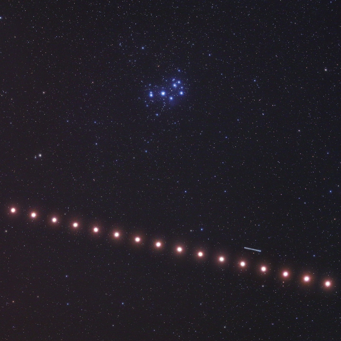 As Mars wanders through Earth's night, it passes about 5 degrees south of the Pleiades star cluster in this composite astrophoto. The skyview was constructed from a series of images captured over a run of 16 consecutive clear nights beginning on July 12. Mars' march across the field of view begins at the far right, the planet's ruddy hue showing a nice contrast with the blue Pleiades stars. Moving much faster across the sky against the distant stars, the fourth planet from the Sun easily passes seventh planet Uranus. Red planet Mars and the ice giant world were in close conjunction, about 1/2 degree apart, on July 16. Continuing its rapid eastward trek, Mars has now left the sister stars and outer planet behind though, passing north of red giant star Aldebaran. Mars will come within about 1/3 degree of Jupiter in planet Earth's sky on August 14.