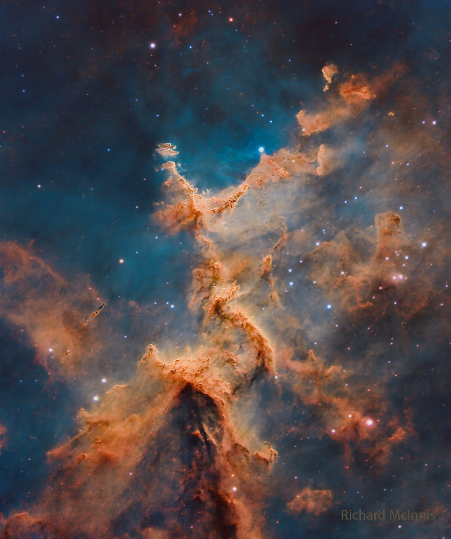 Cosmic clouds form fantastic shapes in the central regions of emission nebula IC 1805. The clouds are sculpted by stellar winds and radiation from massive hot stars in the nebula's newborn star cluster, Melotte 15. About 1.5 million years young, the cluster stars are scattered in this colorful skyscape, along with dark dust clouds in silhouette against glowing atomic gas. A composite of narrowband and broadband telescopic images, the view spans about 15 light-years and includes emission from ionized hydrogen, sulfur, and oxygen atoms mapped to green, red, and blue hues in the popular Hubble Palette. Wider field images reveal that IC 1805's simpler, overall outline suggests its popular name - the Heart Nebula. IC 1805 is located about 7,500 light years away toward the boastful constellation Cassiopeia.