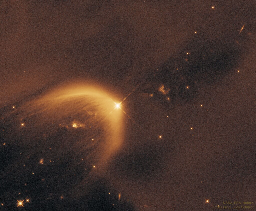What is the cause of this unusual parabolic structure?  This illuminated cavity, known as LDN 1471, was created by a newly forming star, seen as the bright source at the peak of the parabola.  This protostar is experiencing a stellar outflow which is then interacting with the surrounding material in the Perseus Molecular Cloud, causing it to brighten.  We see only one side of the cavity -- the other side is hidden by dark dust.  The parabolic shape is caused by the widening of the stellar-wind blown cavity over time. Two additional structures can also be seen either side of the protostar; these are known as Herbig-Haro objects, again caused by the interaction of the outflow with the surrounding material.  What causes the striations on the cavity walls, though, remains unknown.  The featured image was taken by NASA and ESA’s Hubble Space Telescope after an original detection by the Spitzer Space Telescope.   Explore Your Universe: Random APOD Generator