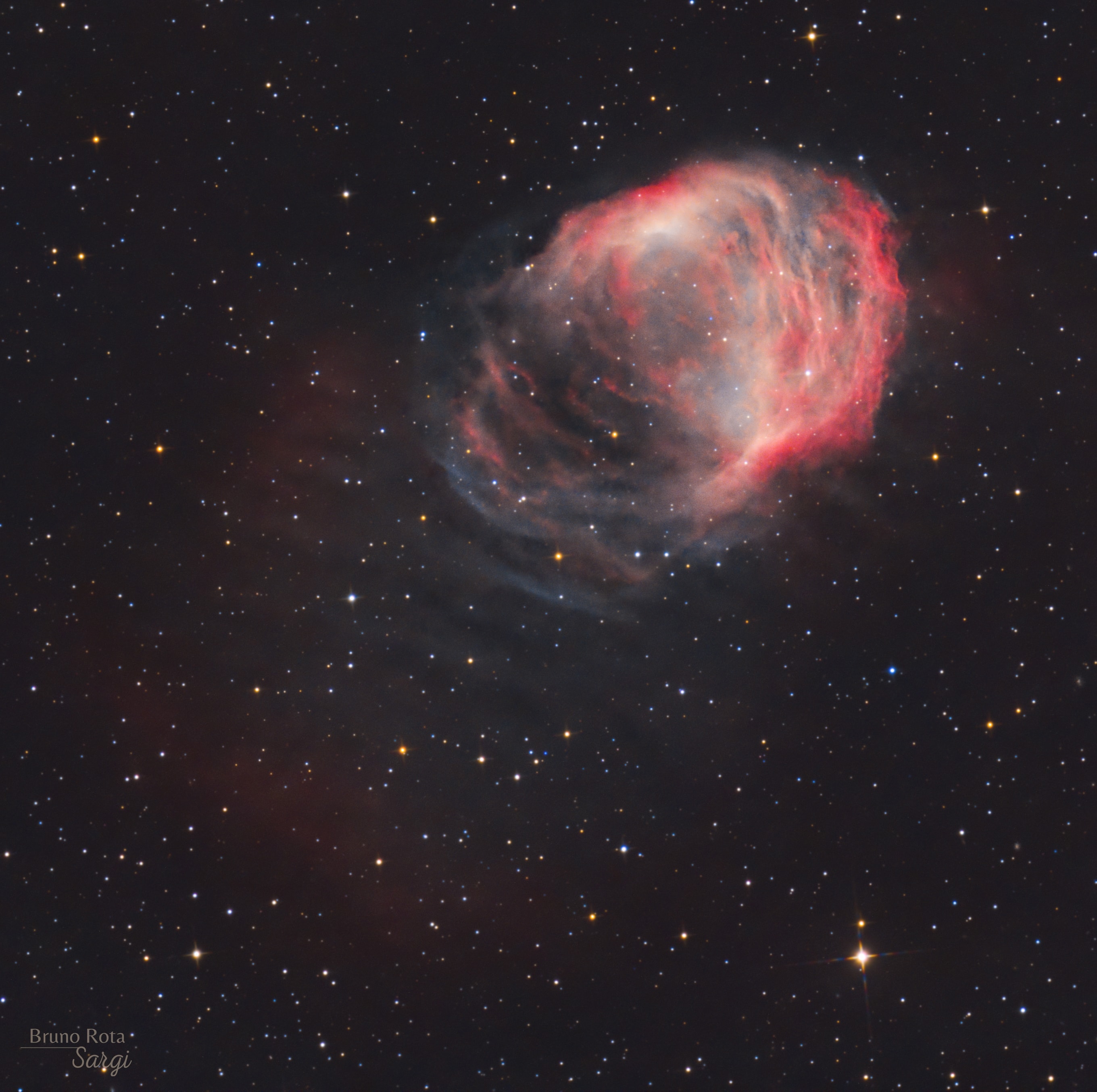 Braided and serpentine filaments of glowing gas suggest this nebula's popular name, The Medusa Nebula. Also known as Abell 21, this Medusa is an old planetary nebula some 1,500 light-years away in the constellation Gemini. Like its mythological namesake, the nebula is associated with a dramatic transformation. The planetary nebula phase represents a final stage in the evolution of low mass stars like the sun as they transform themselves from red giants to hot white dwarf stars and in the process shrug off their outer layers. Ultraviolet radiation from the hot star powers the nebular glow. The Medusa's transforming star is the faint one near the center of the overall bright crescent shape. In this deep telescopic view, fainter filaments clearly extend below and to the left. The Medusa Nebula is estimated to be over 4 light-years across.