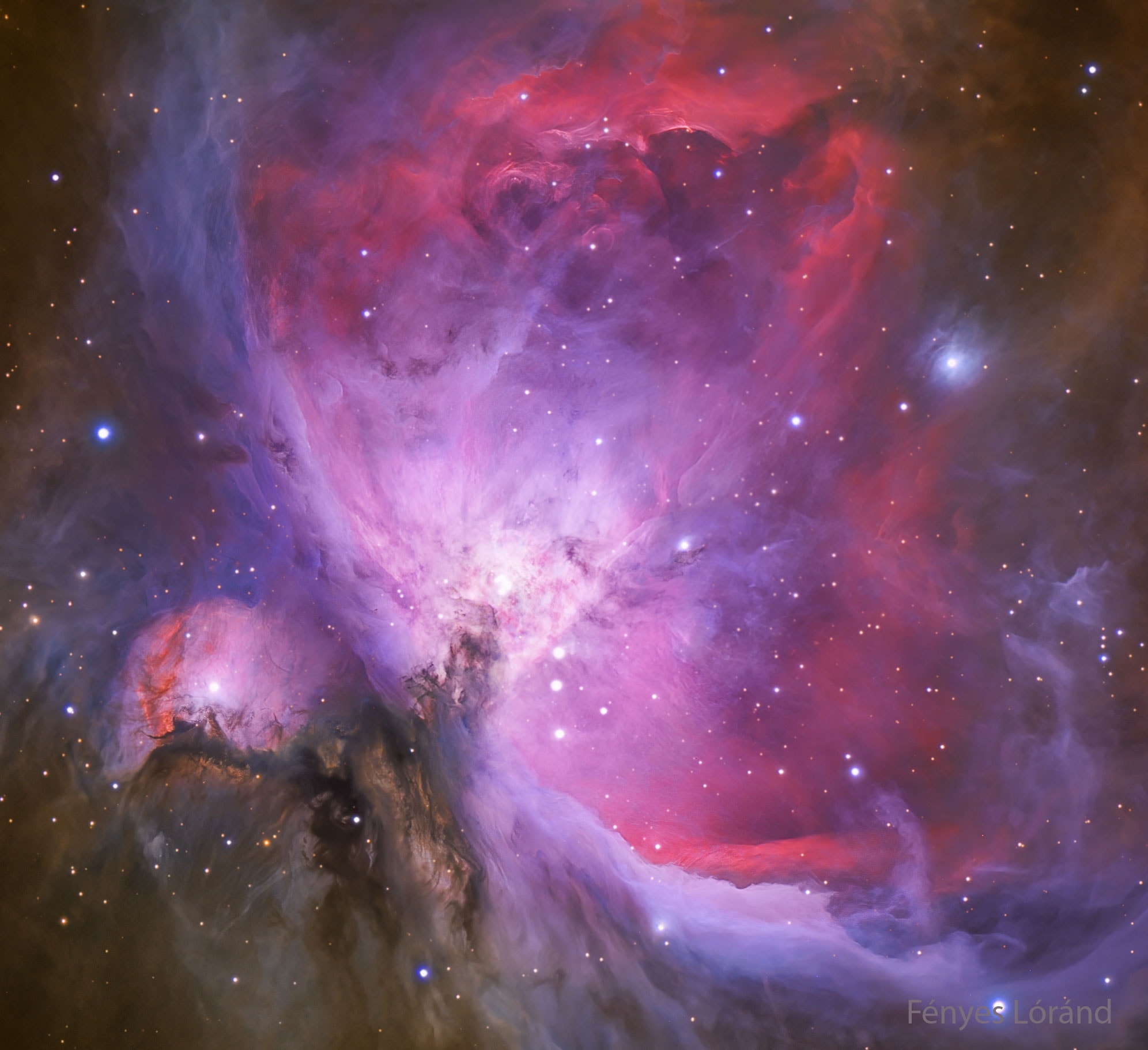 The Great Nebula in Orion, an immense, nearby starbirth region, is probably the most famous of all astronomical nebulas.  Here, glowing gas surrounds hot young stars at the edge of an immense interstellar molecular cloud only 1500 light-years away.  In the featured deep image in assigned colors highlighted by emission in oxygen and hydrogen, wisps and sheets of dust and gas are particularly evident.  The Great Nebula in Orion can be found with the unaided eye near the easily identifiable belt of three stars in the popular constellation Orion.  In addition to housing a bright open cluster of stars known as the Trapezium, the Orion Nebula contains many stellar nurseries.   These nurseries contain much hydrogen gas, hot young stars, proplyds, and stellar jets spewing material at high speeds.  Also known as M42, the Orion Nebula spans about 40 light years and is located in the same spiral arm of our Galaxy as the Sun.