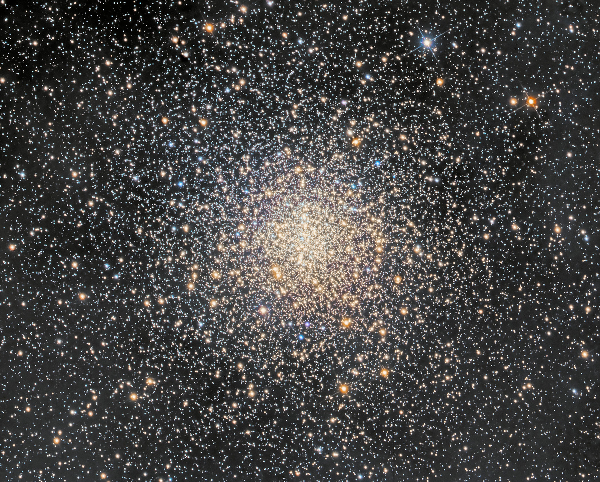Messier 4 can be found west of bright red-giant star Antares, alpha star of the constellation Scorpius. M4 itself is only just visible from dark sky locations, even though the globular cluster of 100,000 stars or so is a mere 5,500 light-years away. Still, its proximity to prying telescopic eyes makes it a prime target for astronomical explorations. Recent studies have included Hubble observations of M4's pulsating cepheid variable stars, cooling white dwarf stars, and ancient, pulsar orbiting exoplanet PSR B1620-26 b. This sharp image was captured with a small telescope on planet Earth. At M4's estimated distance it spans about 50 light-years across the core of the globular star cluster.