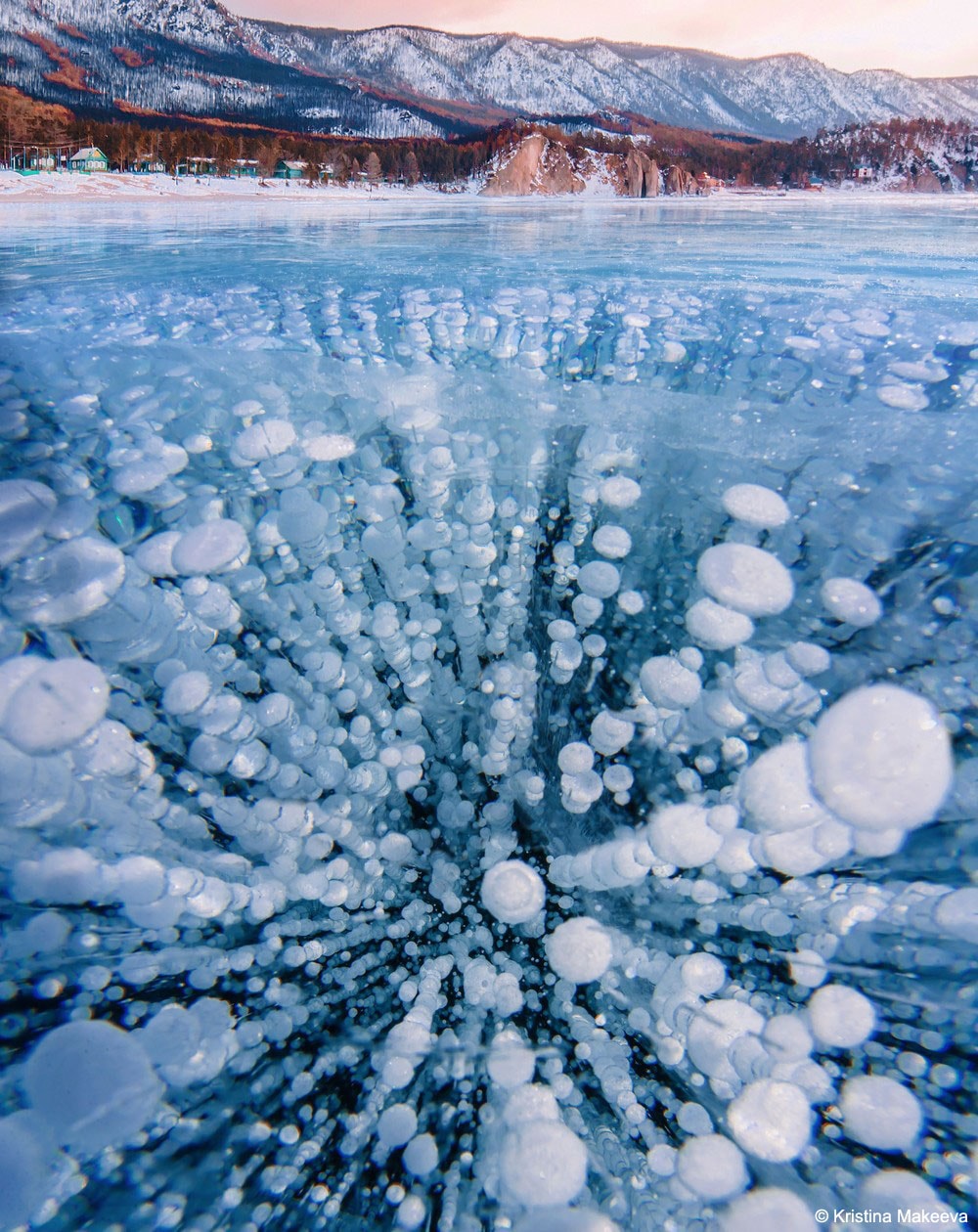 What are these bubbles frozen into Lake Baikal? Methane.  Lake Baikal, a UNESCO World Heritage Site in Russia, is the world's largest (by volume), oldest, and deepest lake, containing over 20% of the world's fresh water. The lake is also a vast storehouse of methane, a greenhouse gas that, if released, could potentially increase the amount of infrared light absorbed by Earth's atmosphere, and so increase the average temperature of the entire planet. Fortunately, the amount of methane currently bubbling out is not climatologically important. It is not clear what would happen, though, were temperatures to significantly increase in the region, or if the water level in Lake Baikal were to drop.  Pictured, bubbles of rising methane froze during winter into the exceptionally clear ice covering the lake.   Jigsaw Challenge: Astronomy Puzzle of the Day