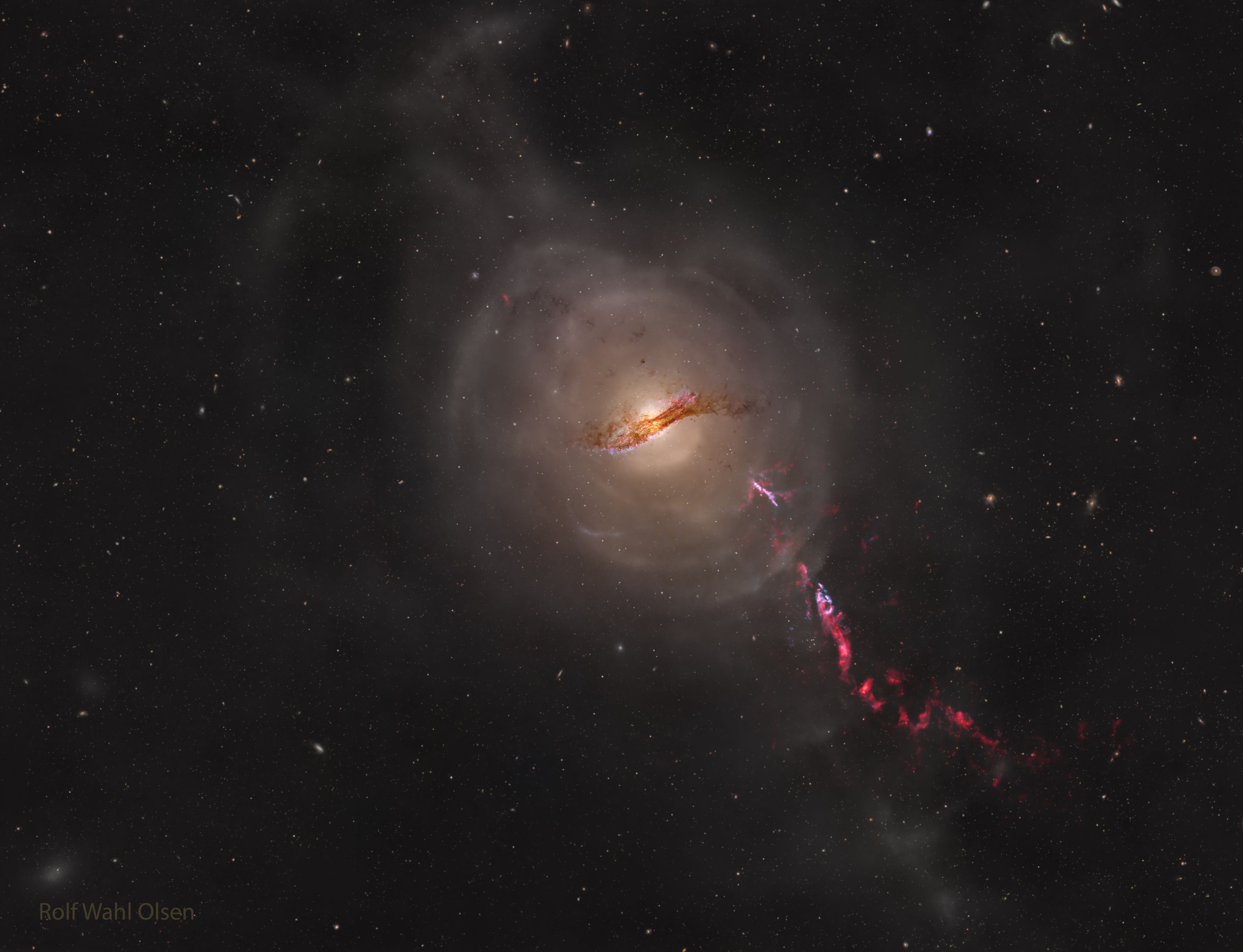 What's the closest active galaxy to planet Earth? That would be Centaurus A, cataloged as NGC 5128, which is only 12 million light-years distant. Forged in a collision of two otherwise normal galaxies, Centaurus A shows several distinctive features including a dark dust lane across its center, outer shells of stars and gas, and jets of particles shooting out from a supermassive black hole at its center.  The featured image captures all of these in a composite series of visible light images totaling over 310 hours captured over the past 10 years with a homebuilt telescope operating in Auckland, New Zealand. The brightness of Cen A's center from low-energy radio waves to high-energy gamma rays underlies its designation as an active galaxy.    Astrophysicists: Browse 3,500+ codes in the Astrophysics Source Code Library