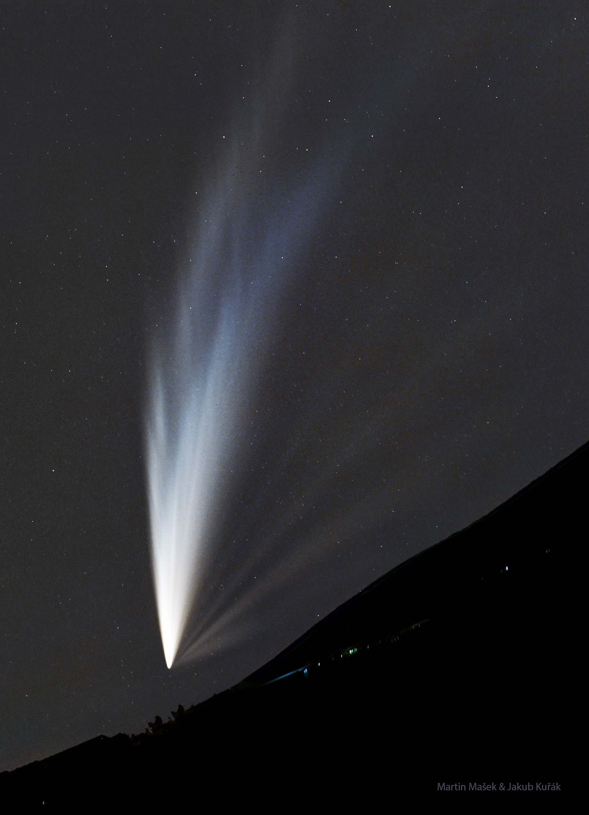 Why does this comet have so many tails? C/2024 G3 (ATLAS) has developed several long and intricate tails visible from Earth's southern hemisphere over the past two weeks. Many observers reported seeing the impressive comet without any optical aid above the western horizon just after sunset. At least six different tails appear in the featured image captured five days ago from the dark skies above Paranal Observatory in Chile.  One possible cause for the multiple tails is dust and gas being expelled from the comet's rotating nucleus. The outward push of the Sun's complex solar wind may also play a role. The huge iceberg-like nucleus of Comet ATLAS appears to have broken up near its closest approach to the Sun two weeks ago.  Unfortunately, Comet ATLAS and its tails are expected to fade significantly over the coming weeks.    Your Sky Surprise: What picture did APOD feature on your birthday? (post 1995)