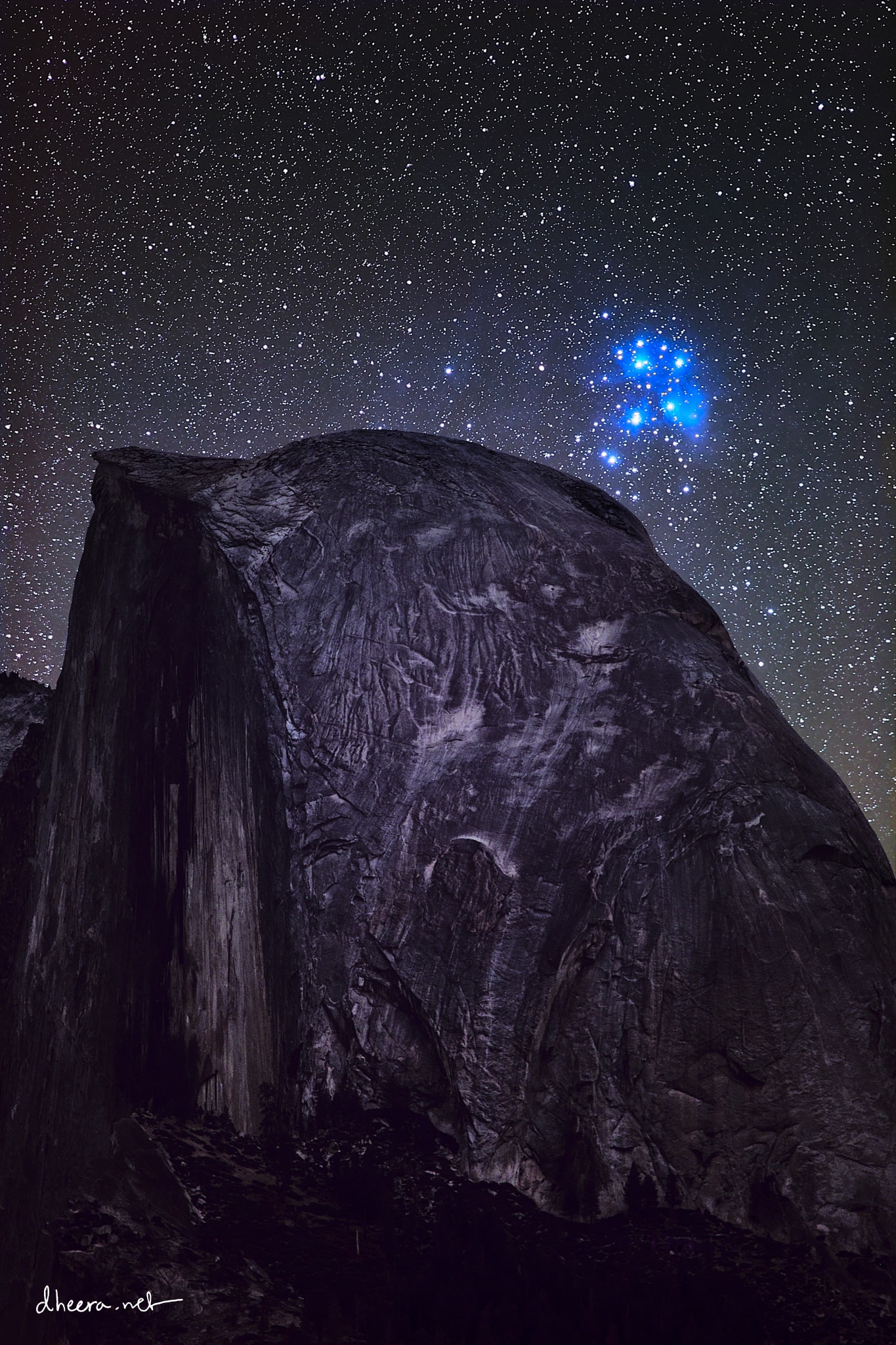 Stars come in bunches.  The most famous bunch of stars on the sky is the Pleiades, a bright cluster that can be easily seen with the unaided eye.  The Pleiades lies only about 450 light years away, formed about 100 million years ago, and will likely last about another 250 million years. Our Sun was likely born in a star cluster, but now, being about 4.5 billion years old, its stellar birth companions have long since dispersed. The Pleiades star cluster is pictured over Half Dome, a famous rock structure in Yosemite National Park in California, USA. The featured image is a composite of 28 foreground exposures and 174 images of the stellar background, all taken from the same location and by the same camera on the same night in October 2019. After calculating the timing of a future juxtaposition of the Pleiades and Half Dome, the astrophotographer was unexpectedly rewarded by an electrical blackout, making the background sky unusually dark.    Astrophysicists: Browse 3,500+ codes in the Astrophysics Source Code Library