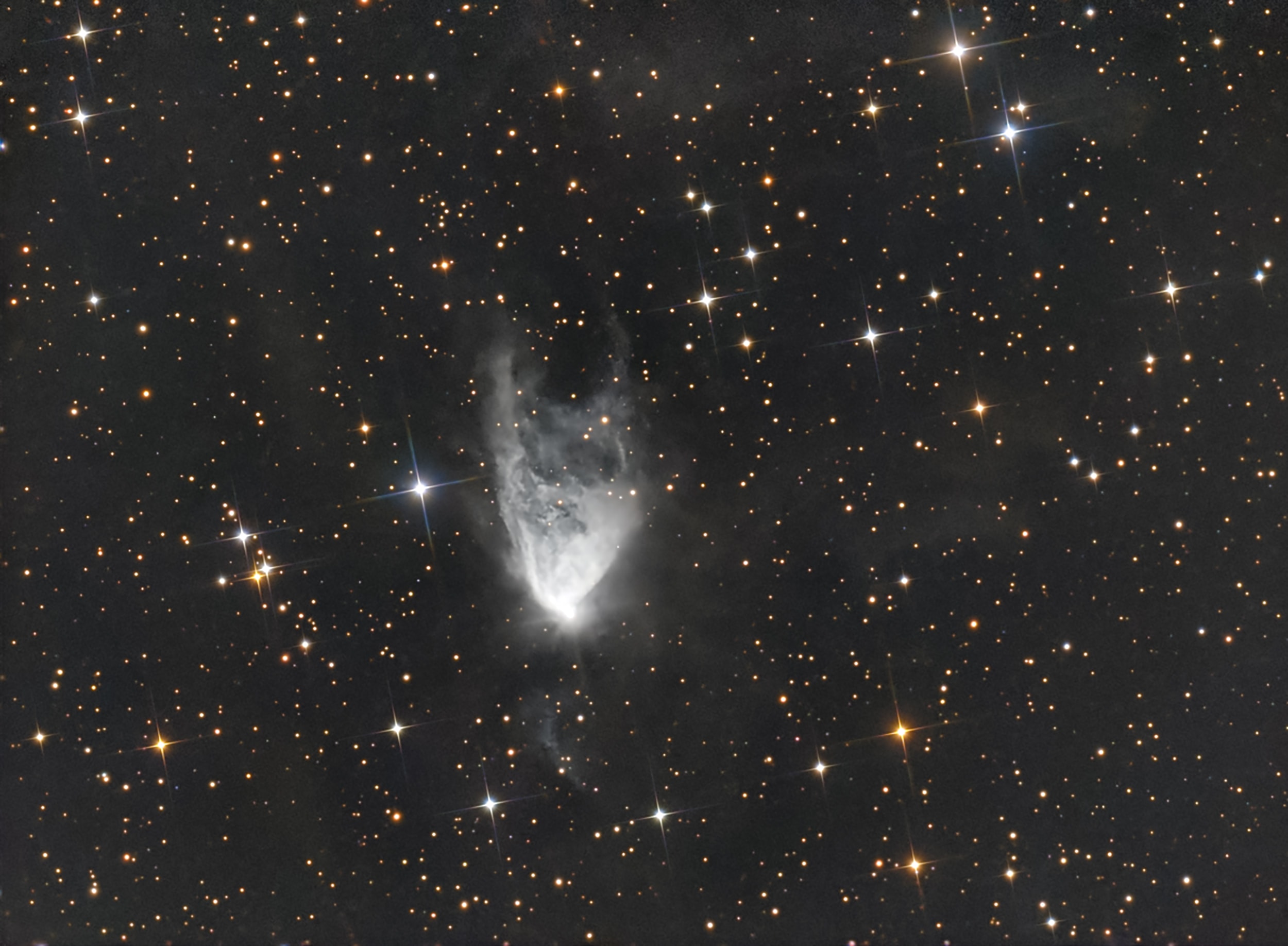 The interstellar cloud of dust and gas captured in this sharp telescopic snapshot is seen to change its appearance noticeably over periods as short as a few weeks. Discovered over 200 years ago and cataloged as NGC 2261, bright star R Monocerotis lies at the tip of the fan-shaped nebula. About one light-year across and 2500 light-years away, NGC 2261 was studied early last century by astronomer Edwin Hubble and the mysterious cosmic cloud is now more famous as Hubble's Variable Nebula. So what makes Hubble's nebula vary? NGC 2261 is composed of a dusty reflection nebula fanning out from the star R Monocerotis.  The leading variability explanation holds that dense knots of obscuring dust pass close to R Mon and cast moving shadows across the dust clouds in the rest of Hubble's Variable Nebula.