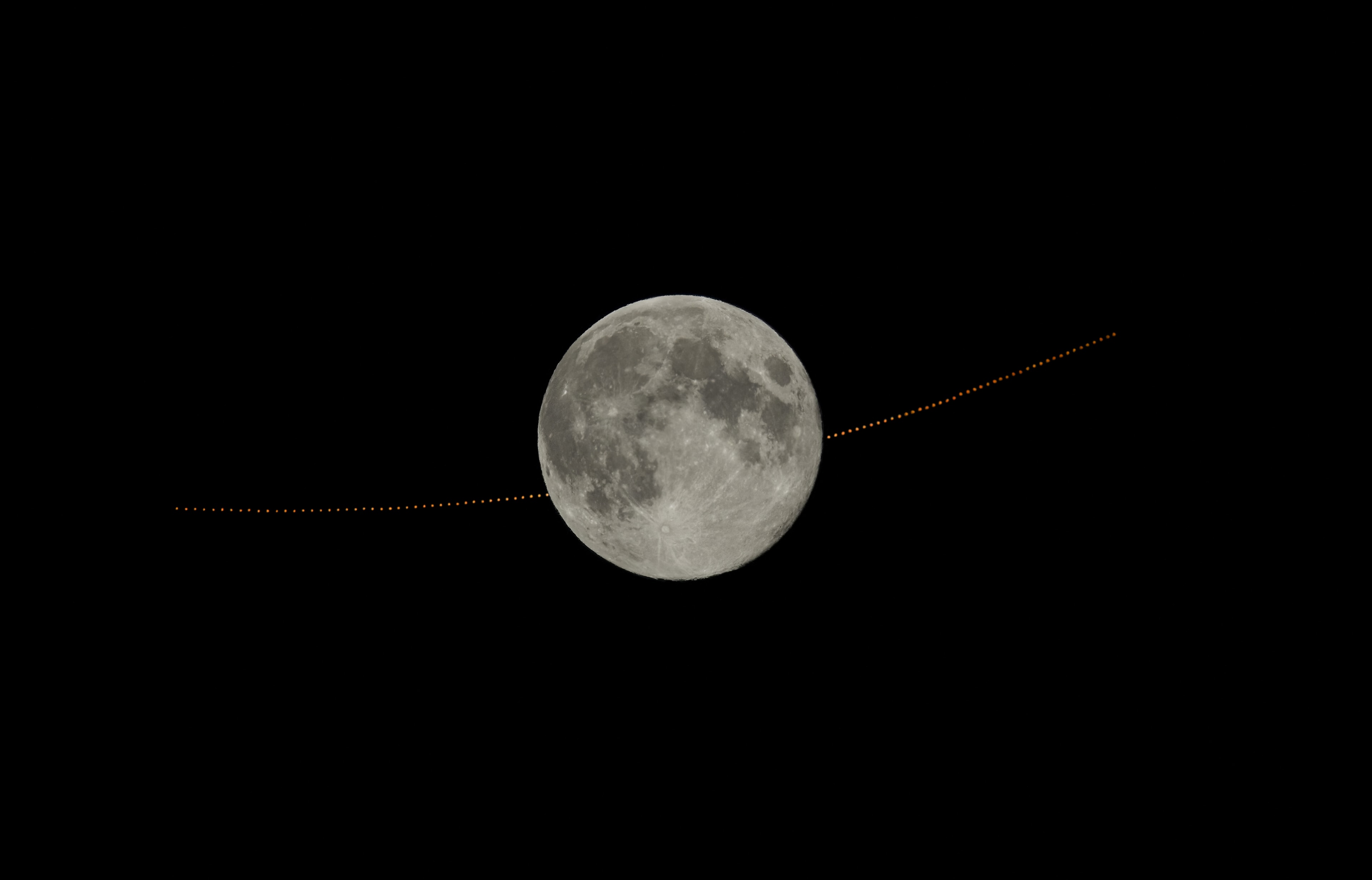 On January 13 a Full Moon and a Full Mars were close, both bright and opposite the Sun in planet Earth's sky. In fact Mars was occulted, passing behind the Moon, when viewed from some locations in North America and northwest Africa.  As seen from Richmond, Virginia, USA, this composite image sequence follows the evening lunar occultation before, during, and after the much anticipated celestial spectacle. The telescopic time series is constructed from an exposure made every two minutes while tracking the Moon over the hours encompassing the event. As a result, the Red Planet's trajectory seems to follow a gently curved path due to the Moon's slightly different rate of apparent motion. The next lunar occultation of bright planet Mars will be on February 9 when the moon is in a waxing gibbous phase. Lunar occultations are only ever visible from a fraction of the Earth's surface, though. The February 9 occultation of Mars will be seen from parts of Russia, China, eastern Canada, Greenland and other (mostly northern) locations, but a close conjunction of a bright Moon with Mars will be more widely visible from planet Earth.   Growing Gallery: Moon-Mars Occultation in January 2025