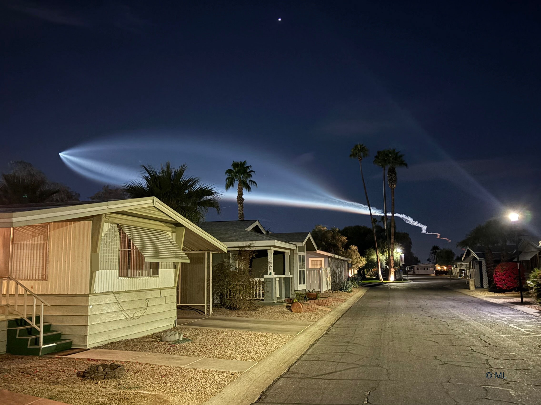 What's happened to the sky? Last Monday, the photogenic launch plume from a SpaceX rocket launch created quite a spectacle over parts of southern California and Arizona.  Looking at times like a giant space fish, the impressive rocket launch from Vandenberg Air Force Base near Lompoc, California, was so bright because it was backlit by the setting Sun. The Falcon 9 rocket successfully delivered to low Earth orbit 23 Starlink communications satellites.  The plume from the first stage is seen on the right, while the soaring upper stage rocket is seen at the apex of the plume toward the left. Venus appears at the top of the frame, while a bright streetlight shines on the far right.  The featured image was captured toward the west after sunset from near Phoenix, Arizona.