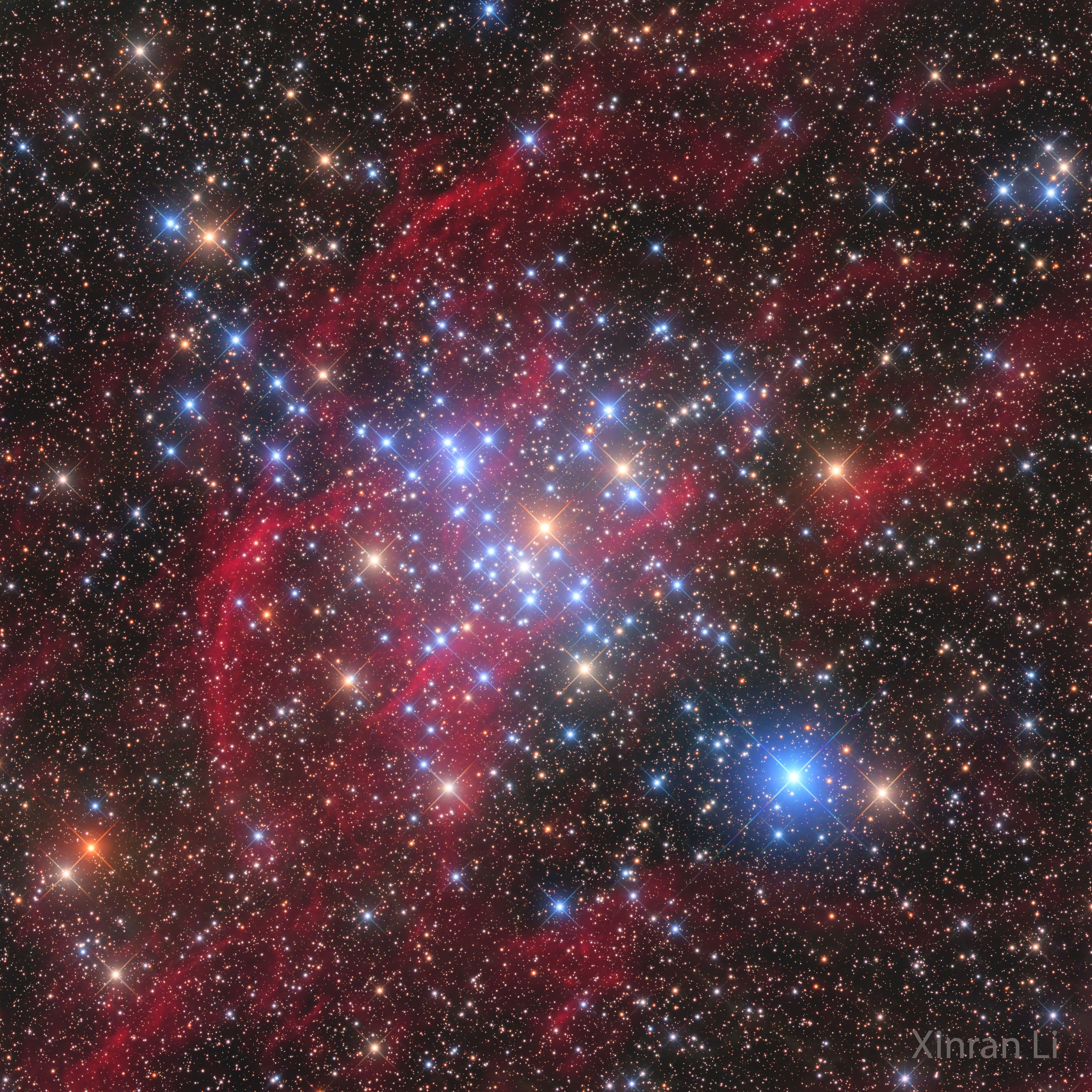 Why are there so many bright blue stars?  Stars are usually born in clusters, and the brightest and most massive of these stars typically glow blue. Less-bright, non-blue stars like our Sun surely also exist in this M41 star cluster but are harder to see. A few bright orange-appearing red giant stars are visible. The red-light filaments are emitted by diffuse hydrogen gas, a color that was specifically filtered and enhanced in this image.  In a hundred million years or so, the bright blue stars will have exploded in supernovas and disappeared, while the slightly different trajectories of the fainter stars will cause this picturesque open cluster to disperse. Similarly, billions of years ago, our own Sun was likely born into a star cluster like M41, but it has long since drifted apart from its sister stars. The featured image was captured over four hours with Chilescope T2 in Chile.