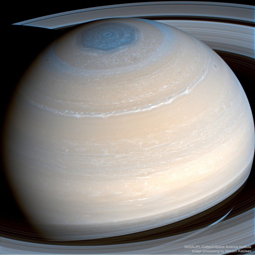 Saturn looks slightly different in infrared light. Bands of clouds show great structure, including long stretching storms.  Also quite striking in infrared is the unusual hexagonal cloud pattern surrounding Saturn's North Pole.  Each side of the dark hexagon spans roughly the width of our Earth. The hexagon's existence was not predicted, and its origin and likely stability remain a topics of research.  Saturn's famous rings circle the planet and cast shadows below the equator. The featured image was taken by the robotic Cassini spacecraft in 2014 in several infrared colors.  In 2017 September, the Cassini mission was brought to a dramatic conclusion when the spacecraft was  directed to dive into the ringed giant.    Your Sky Surprise: What picture did APOD feature on your birthday? (post 1995)