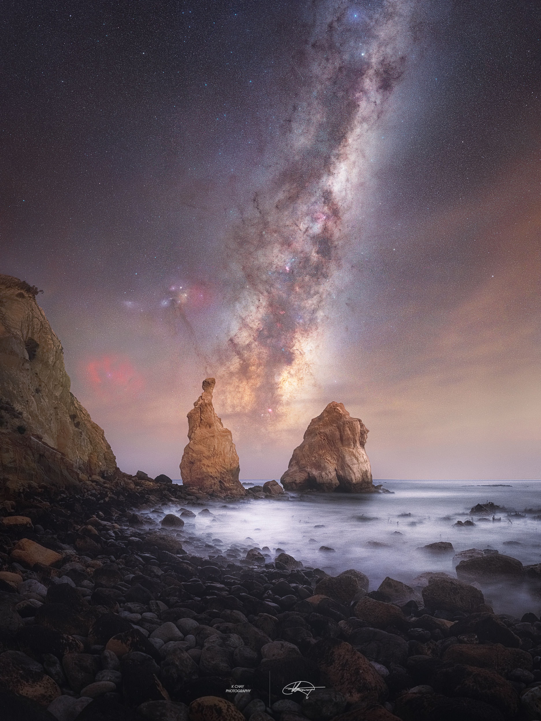 Does the Milky Way always rise between these two rocks? No. Capturing this stunning alignment took careful planning: being in the right place at the right time. In the featured image taken in June 2024 from Otago, New Zealand, the bright central core of our Milky Way Galaxy, home to the many of our Galaxy's 400 billion stars, can be seen between two picturesque rocks spires.  For observers in Earth's Northern Hemisphere, the core is only visible throughout the summer. As Earth orbits the Sun, different parts of the Milky Way become visible at different angles at different times of the night. As Earth rotates, the orientation of the Milky Way in the sky also shifts -- sometimes standing vertically as seen in the featured image, and other times stretching parallel to the horizon, making it harder to see. In early June, observers can watch it emerge low on the horizon after sunset and gradually arc upward to reveal its full grandeur.
