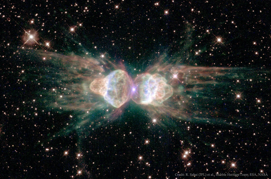 Why isn't this ant a big sphere?  Planetary nebula Mz3 is being cast off by a star similar to our Sun that is, surely, round.  Why then would the gas that is streaming away create an ant-shaped nebula that is distinctly not round?  Clues might include the high 1000-kilometer per second speed of the expelled gas, the light-year long length of the structure, and the magnetism of the star featured here at the nebula's center.  One possible answer is that Mz3 is hiding a second, dimmer star that orbits close in to the bright star.  A competing hypothesis holds that the central star's own spin and magnetic field are channeling the gas.  Since the central star appears to be so similar to our own Sun, astronomers hope that increased understanding of the history of this giant space ant can provide useful insight into the likely future of our own Sun and Earth.   Explore Your Universe: Random APOD Generator