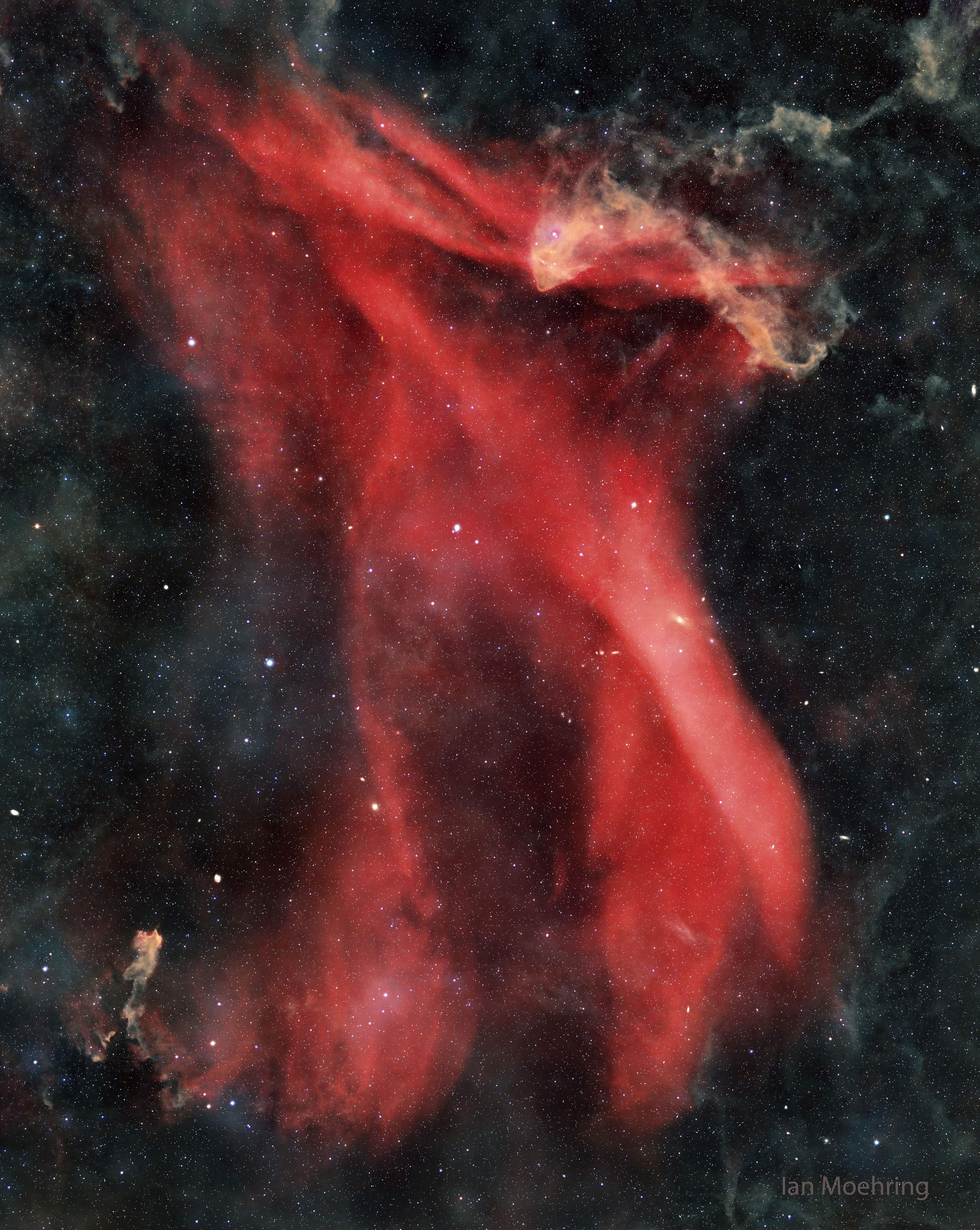It is one of the largest nebulas on the sky -- why isn't it better known? Roughly the same angular size as the Andromeda Galaxy, the Great Lacerta Nebula can be found toward the constellation of the Lizard (Lacerta). The emission nebula is difficult to see with wide-field binoculars because it is so faint, but also usually difficult to see with a large telescope because it is so great in angle -- spanning about three degrees. The depth, breadth, waves, and beauty of the nebula -- cataloged as Sharpless 126 (Sh2-126) -- can best be seen and appreciated with a long duration camera exposure. The featured image is one such combined exposure -- in this case taken over three nights in August through dark skies in Moses Lake, Washington, USA. The hydrogen gas in the Great Lacerta Nebula glows red because it is excited by light from the bright star 10 Lacertae, one of the bright blue stars just to the left of the red-glowing nebula's center.  Most of the stars and nebula are about 1,200 light years distant.    Jigsaw Universe: Astronomy Puzzle of the Day