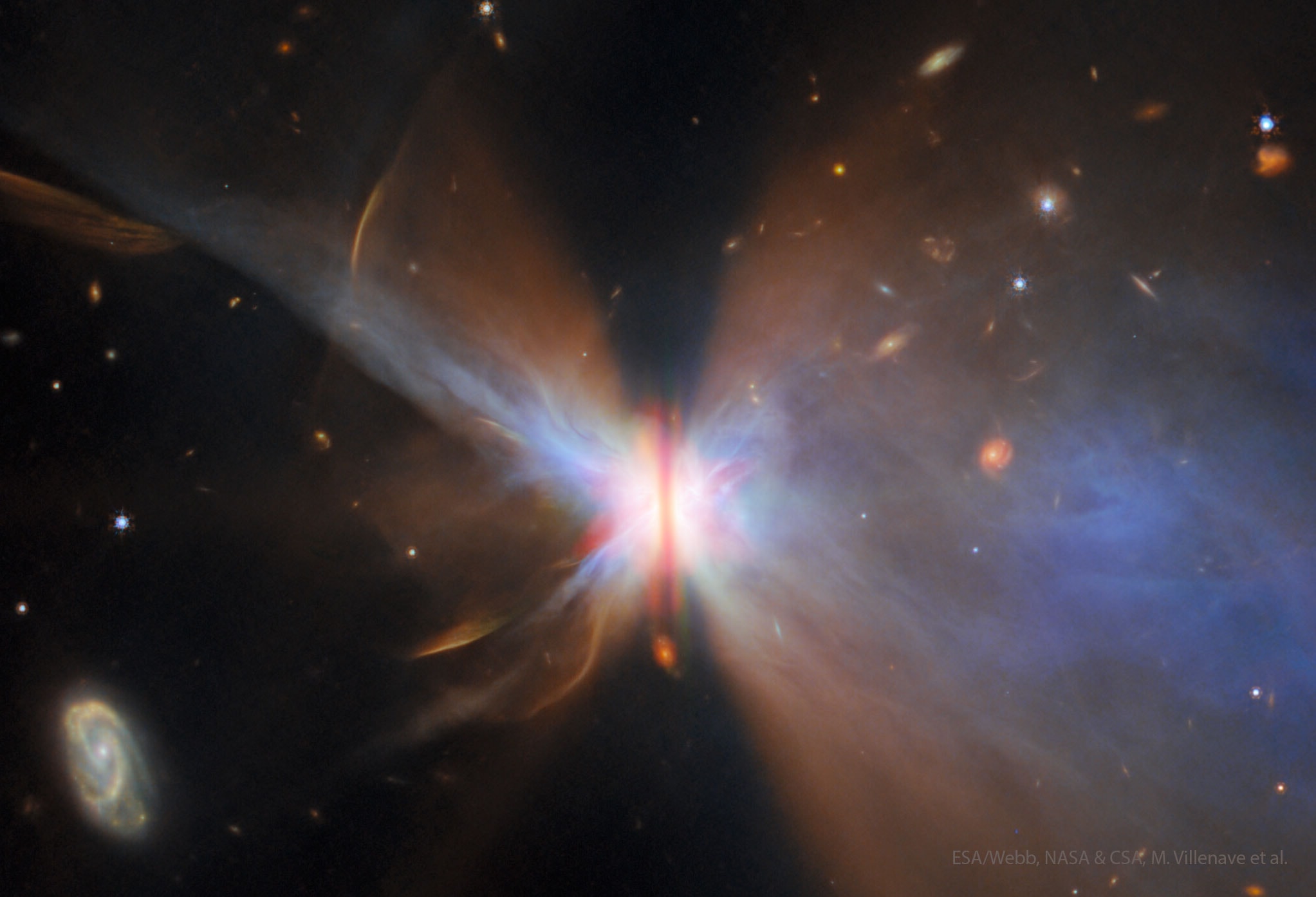 This butterfly can hatch planets. The nebula fanning out from the star IRAS 04302+2247 may look like the wings of a butterfly, while the vertical brown stripe down the center may look like the butterfly's body -- but together they indicate an active planet-forming system. The featured picture was captured recently in infrared light by the Webb Space Telescope. Pictured, the vertical disk is thick with the gas and dust from which planets form. The disk shades visible and (most) infrared light from the central star, allowing a good view of the surrounding dust that reflects out light. In the next few million years, the dust disk will likely fragment into rings through the gravity of newly hatched planets.  And a billion years from now, the remaining gas and dust will likely dissipate, leaving mainly the planets -- like in our Solar System.    Explore the Universe: Random APOD Generator