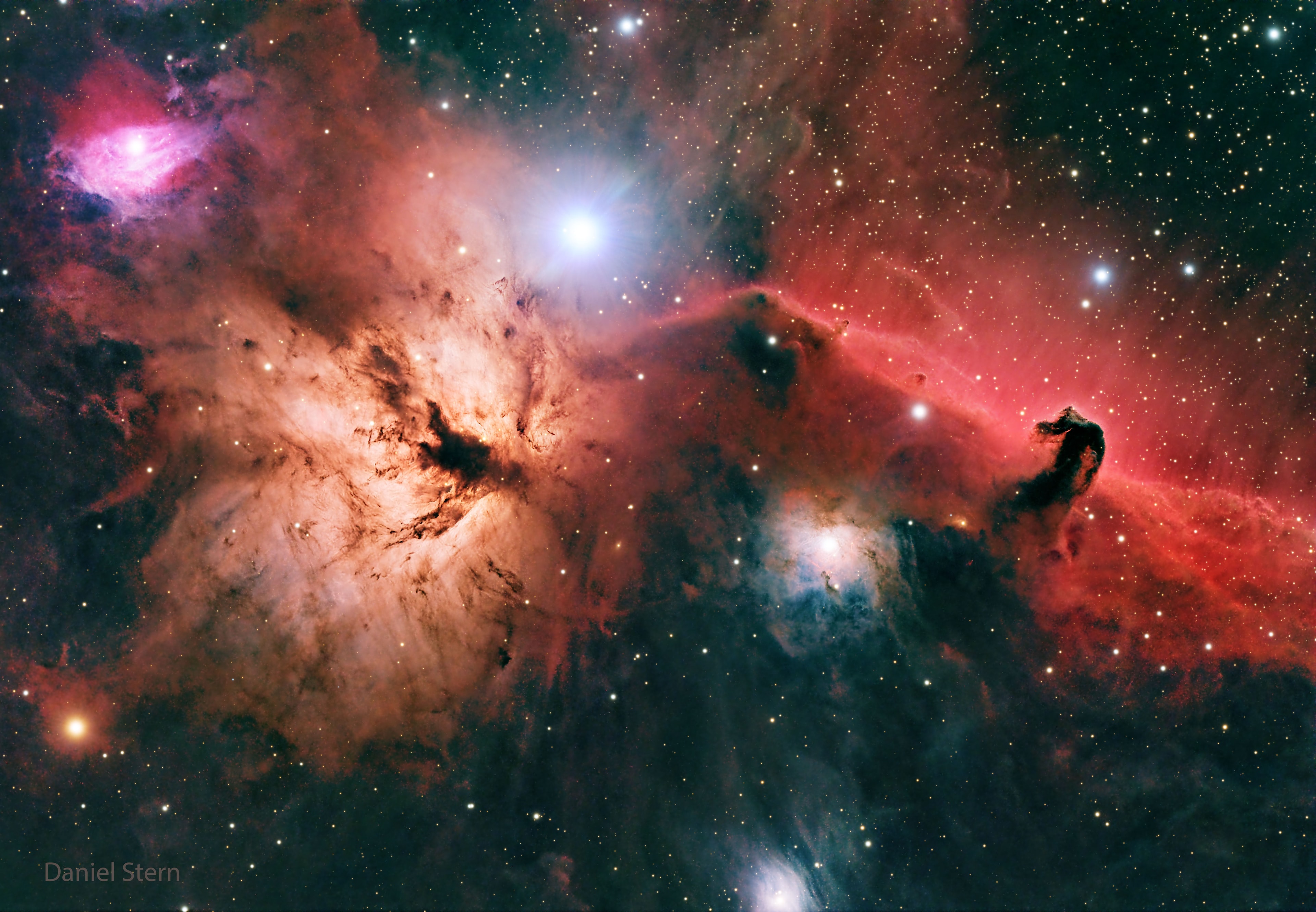 The Horsehead Nebula is one of the most famous nebulae on the sky.  It is visible as the dark indentation to the orange emission nebula at the far right of the featured picture.  The horse-head feature is dark because it is really an opaque dust cloud that lies in front of the bright emission nebula. Like clouds in Earth's atmosphere, this cosmic cloud has assumed a recognizable shape by chance.  After many thousands of years, the internal motions of the cloud will surely alter its appearance.  The emission nebula's orange color is caused by electrons recombining with protons to form hydrogen atoms.  Toward the lower left of the image is the Flame Nebula, an orange-tinged nebula that also contains intricate filaments of dark dust.