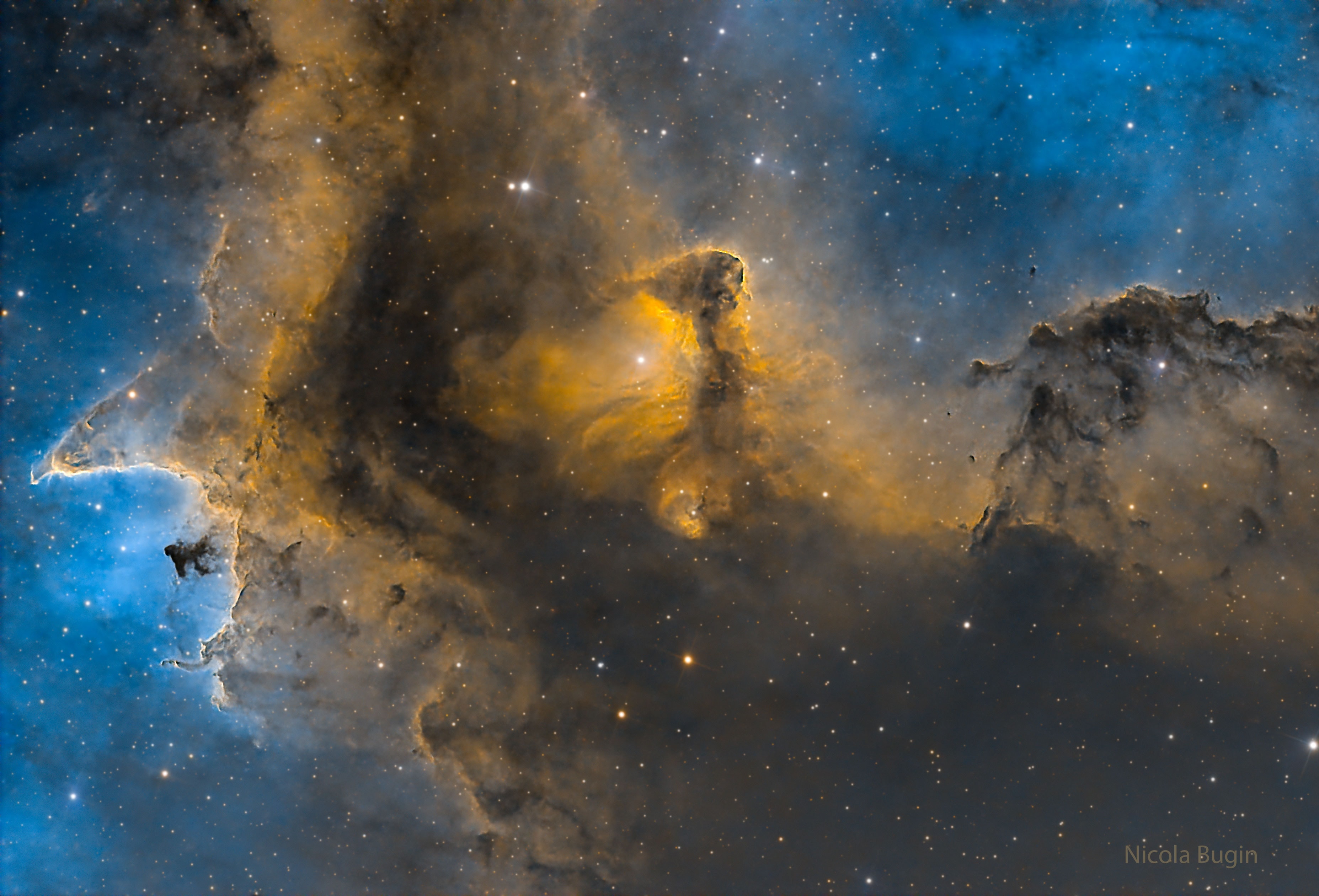 This cosmic close-up looks deep inside the Soul Nebula. The dark and brooding dust clouds outlined by bright ridges of glowing gas are cataloged as IC 1871. About 25 light-years across, the telescopic field of view spans only a small part of the much larger Heart and Soul nebulae. At an estimated distance of 6,500 light-years, the star-forming complex lies within the Perseus spiral arm of the Milky Way, seen in planet Earth's skies toward the constellation of the Queen of Aethiopia (Cassiopeia). An example of triggered star formation, the dense star-forming clouds of IC 1871 are themselves sculpted by the intense winds and radiation of the region's massive young stars. This color image adopts a palette made popular in Hubble images of star-forming regions.