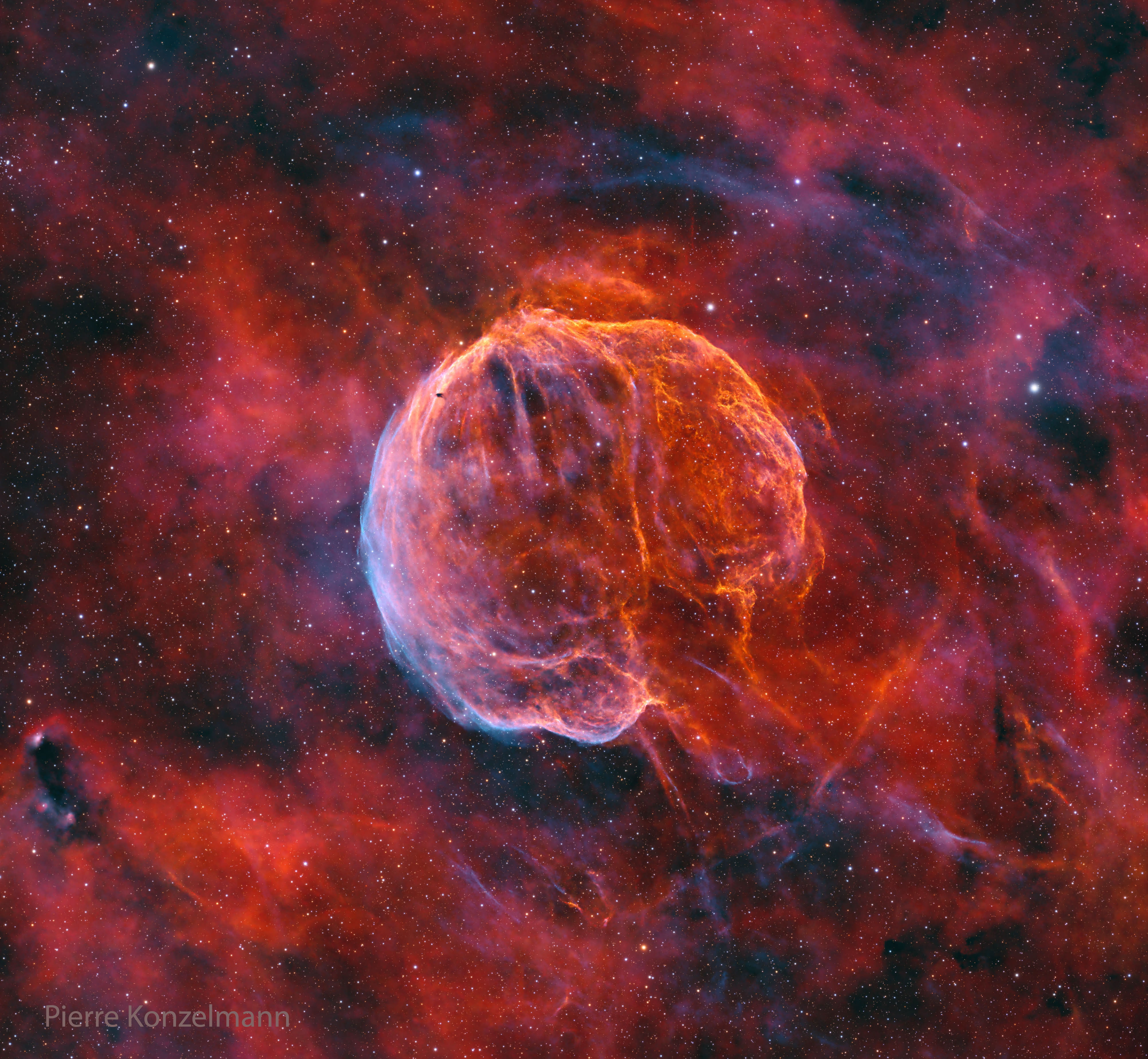 What powers this unusual nebula? CTB 1 is the expanding gas shell that was left when a massive star toward the constellation of Cassiopeia exploded about 10,000 years ago. The star likely detonated when it ran out of elements, near its core, that could create stabilizing pressure with nuclear fusion. The resulting supernova remnant, nicknamed the Medulla Nebula for its brain-like shape, still glows in visible light because of the heat generated by its collision with confining interstellar gas.  Why the nebula also glows in X-ray light, though, remains a topic of research. One hypothesis holds that an energetic pulsar was created and powers the nebula with a fast outwardly moving wind. Following this lead, a pulsar was found in radio waves that appears to have been expelled by the supernova explosion at over 1000 kilometers per second.  Although the Medulla Nebula appears as large as a full moon, it is so faint that it took 84-hours of exposure with a small telescope in Texas, USA, to create the featured image.