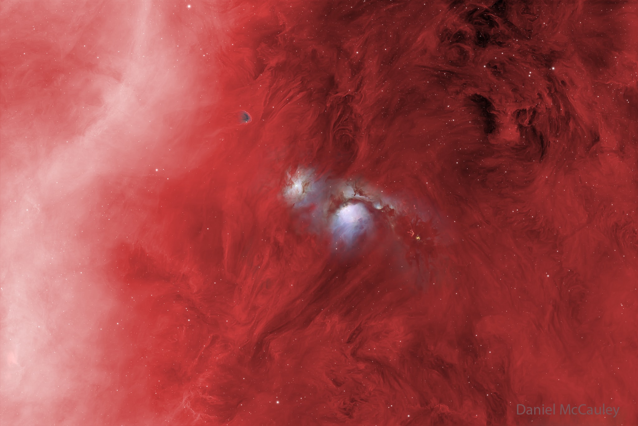 In the vast Orion Molecular Cloud complex, several bright blue nebulas are particularly apparent.  Pictured here in the center are two of the most prominent reflection nebulas - dust clouds lit by the reflecting light of bright embedded stars.  The more famous nebula is M78, in the image center, cataloged over 200 years ago.  To its upper left is the lesser known NGC 2071.  Astronomers continue to study these reflection nebulas to better understand how interior stars form.  The overall red glow is from diffuse hydrogen gas that covers much of the Orion complex that spans much of the constellation of Orion. Nearby in the greater complex, which lies about 1,500 light years away, are the Orion Nebula, the Horsehead Nebula, and Barnard's Loop -- partially seen here as the white band on the upper left.    Almost Hyperspace: Random APOD Generator