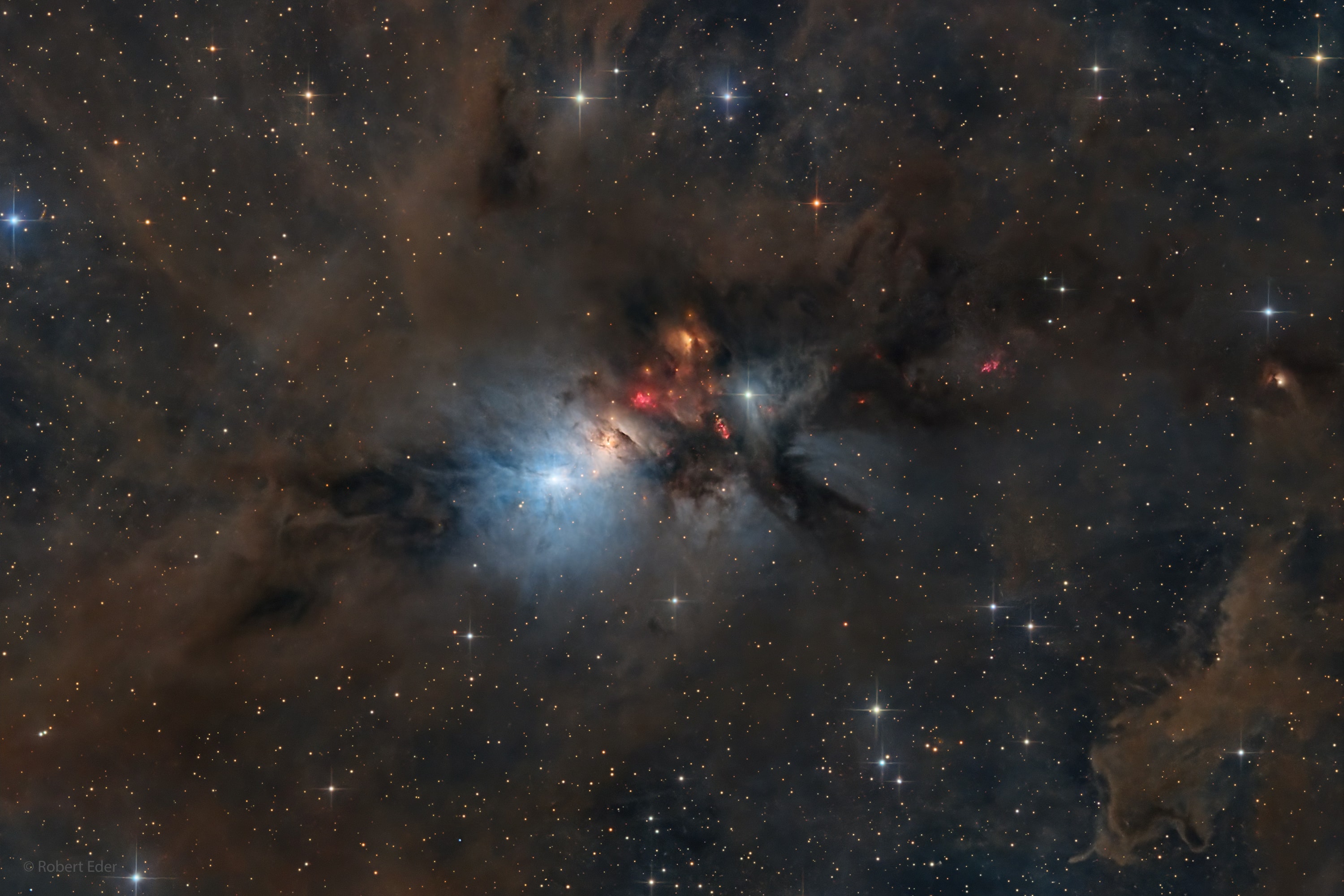 NGC 1333 is seen in visible light as a reflection nebula, dominated by bluish hues characteristic of starlight reflected by interstellar dust. A mere 1,000 light-years distant toward the heroic constellation Perseus, it lies at the edge of a large, star-forming molecular cloud. This telescopic close-up spans over two full moons on the sky or just over 15 light-years at the estimated distance of NGC 1333. It shows details of the dusty region along with telltale hints of contrasty red emission from Herbig-Haro objects, jets and shocked glowing gas emanating from recently formed stars. In fact, NGC 1333 contains hundreds of stars less than a million years old, most still hidden from optical telescopes by the pervasive stardust. The chaotic environment may be similar to one in which our own Sun formed over 4.5 billion years ago.