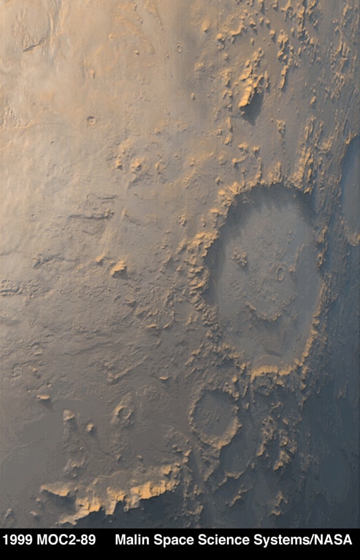 Mars has put on a happy face.  The Martian crater Galle is famous because it has internal markings that make it look like a face that is both smiling and winking.  These markings were originally discovered in the 1970s in pictures taken by the Viking Orbiter.  The Mars Global Surveyor (MGS) spacecraft that orbited Mars from 1996 to 2006 captured the featured picture.  Happy Face Crater and its iconic features were formed by chance billions of years ago when a city-sized asteroid slammed into the Martian surface.  All rocky planets and moons in our Solar System show impact craters, with the highest number of craters found on Earth's Moon and the planet Mercury. Earth and Venus would show the most, though, were it not for weather and erosion.   Sky Surprise: What picture did APOD feature on your birthday? (after 1995)