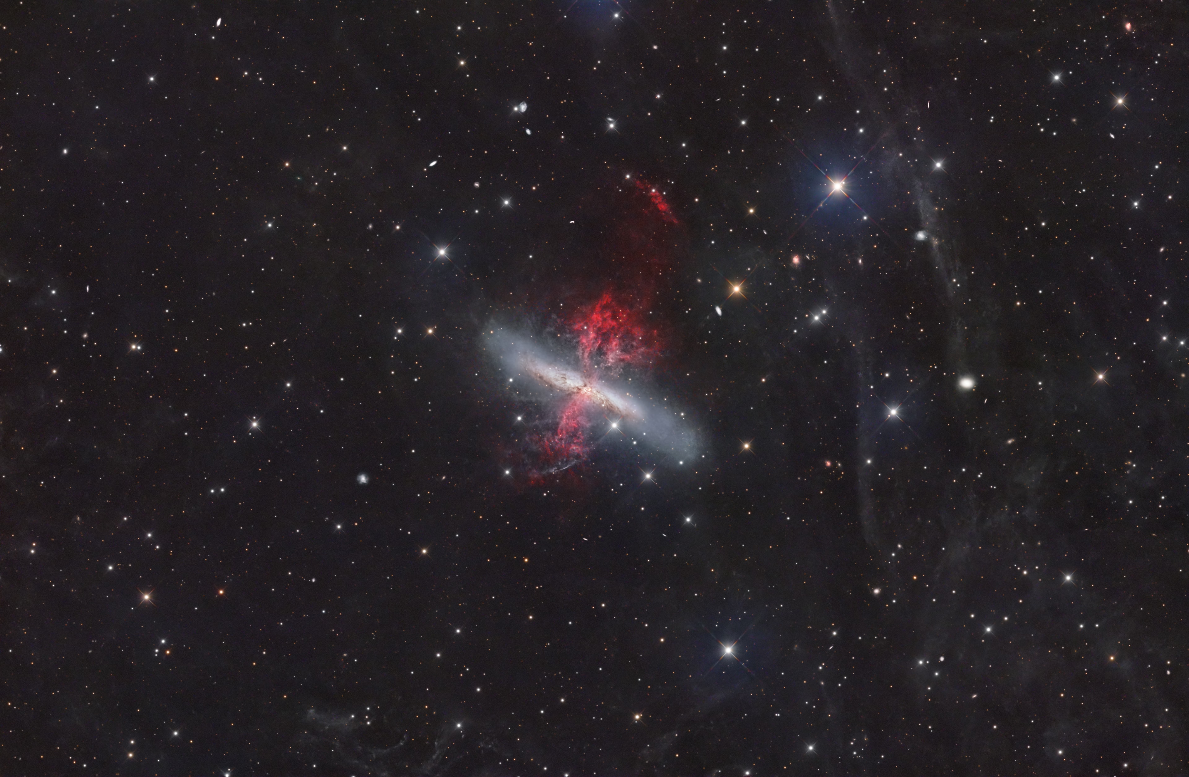 Messier 82 is a starburst galaxy with a superwind. In fact, through supernova explosions and powerful winds from massive stars, the burst of star formation in M82 is driving a prodigious outflow. Evidence for the superwind from the galaxy's central regions is clear in the sharp telescopic portrait. The composite image includes 33 hours of narrowband data, highlighting emission from long outflow filaments of atomic hydrogen gas in reddish hues. Some of the gas in the superwind, enriched in heavy elements forged in the massive stars, will eventually escape into intergalactic space. Triggered by a close encounter with nearby large galaxy M81, the furious burst of star formation in M82 should last about 100 million years or so. Also known as the Cigar Galaxy for its elongated visual appearance, M82 is about 30,000 light-years across. It lies 12 million light-years away near the northern boundary of Ursa Major.