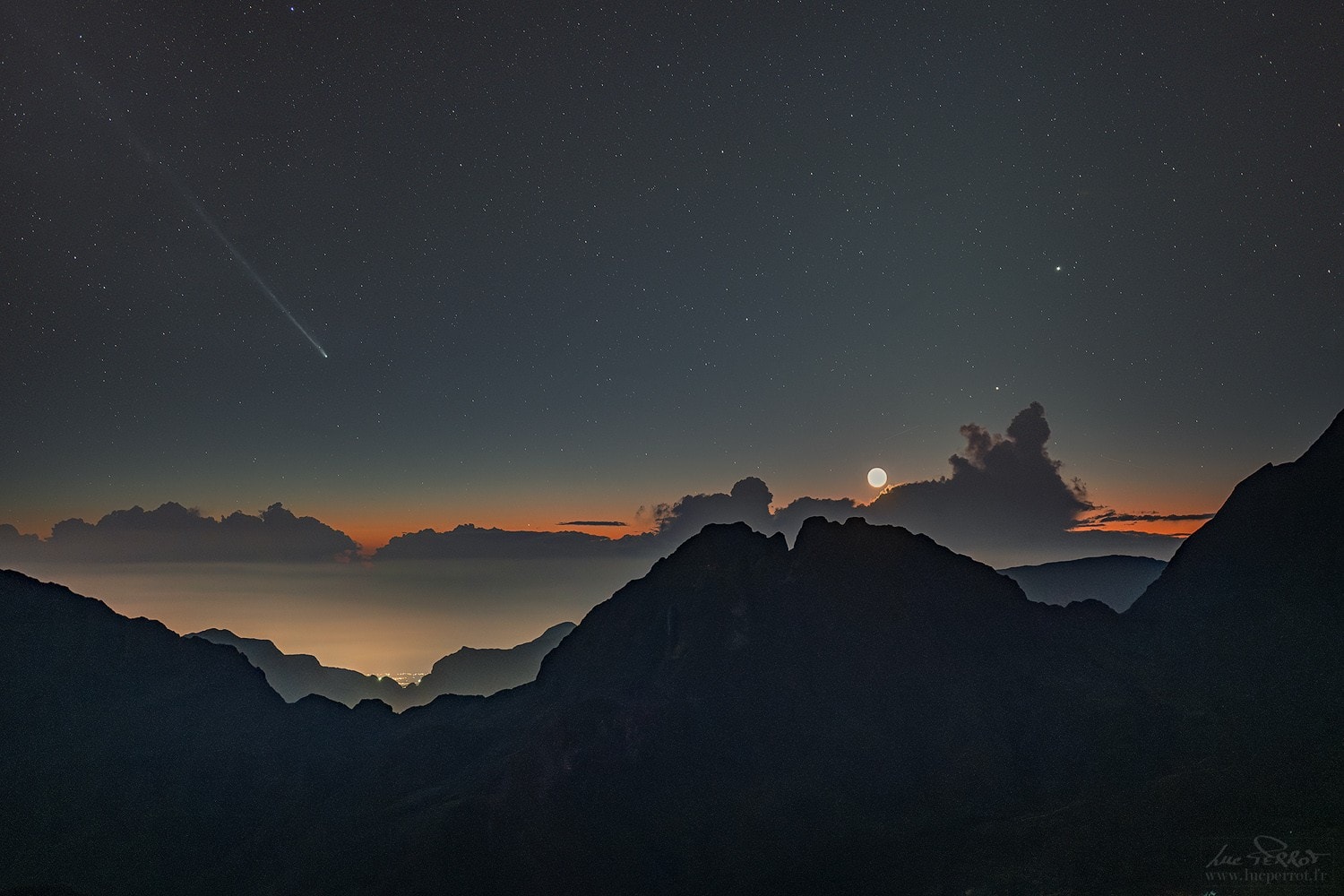 Near the eastern horizon before sunrise, Comet C/2025 R3 PanSTARRS is getting brighter. Readily visible in binoculars and small telescopes, the comet may be just on the verge of naked-eye visibility from dark sky sites. Though it was not quite apparent to the eye, PanSTARRS is still easy to spot in this camera image taken on April 16. In the view from a volcanic peak overlooking France's Reunion Island, planet Earth, the comet shares eastern predawn skies with naked-eye planets Mars and Mercury and fainter Neptune. Saturn is hiding behind the low cloudbank that doesn't quite hide an old crescent Moon. This is a good weekend for northern hemisphere comet watchers to try to catch PanSTARRS an hour or so before sunrise, as the comet grows brighter approaching its perihelion on April 19. On April 26 the comet makes its closest approach to our fair planet but by then will be difficult to see in the solar glare. Good views of this comet PanSTARRS in late April and early May will be from the southern hemisphere.