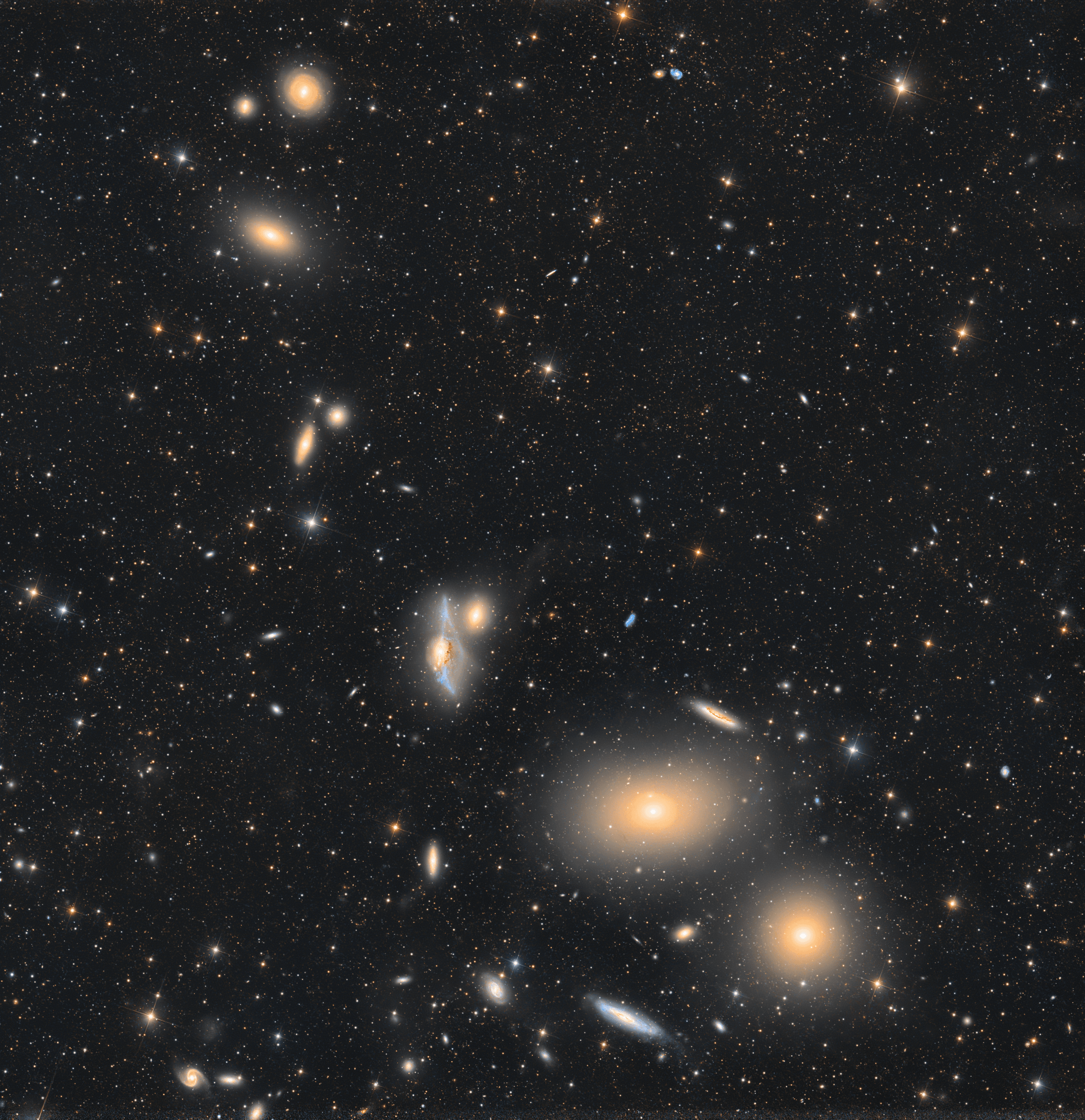 Near the heart of the Virgo Galaxy Cluster, a string of galaxies known as Markarian's Chain stretches across this telescopic field of view. Anchored in the frame at bottom right by prominent lenticular galaxies, M84 (bottom) and M86, you can follow the chain's gentle arc up and toward the left. Near center you'll spot the pair of interacting galaxies NGC 4438 and NGC 4435, known to some as Markarian's Eyes. An estimated 50 million light-years distant, the Virgo Cluster itself is the nearest galaxy cluster. With up to about 2,000 member galaxies, it has a noticeable gravitational influence on our own Local Group of Galaxies. Within the Virgo Cluster at least seven galaxies in Markarian's Chain  appear to move coherently, while others may appear to be part of the chain by chance.