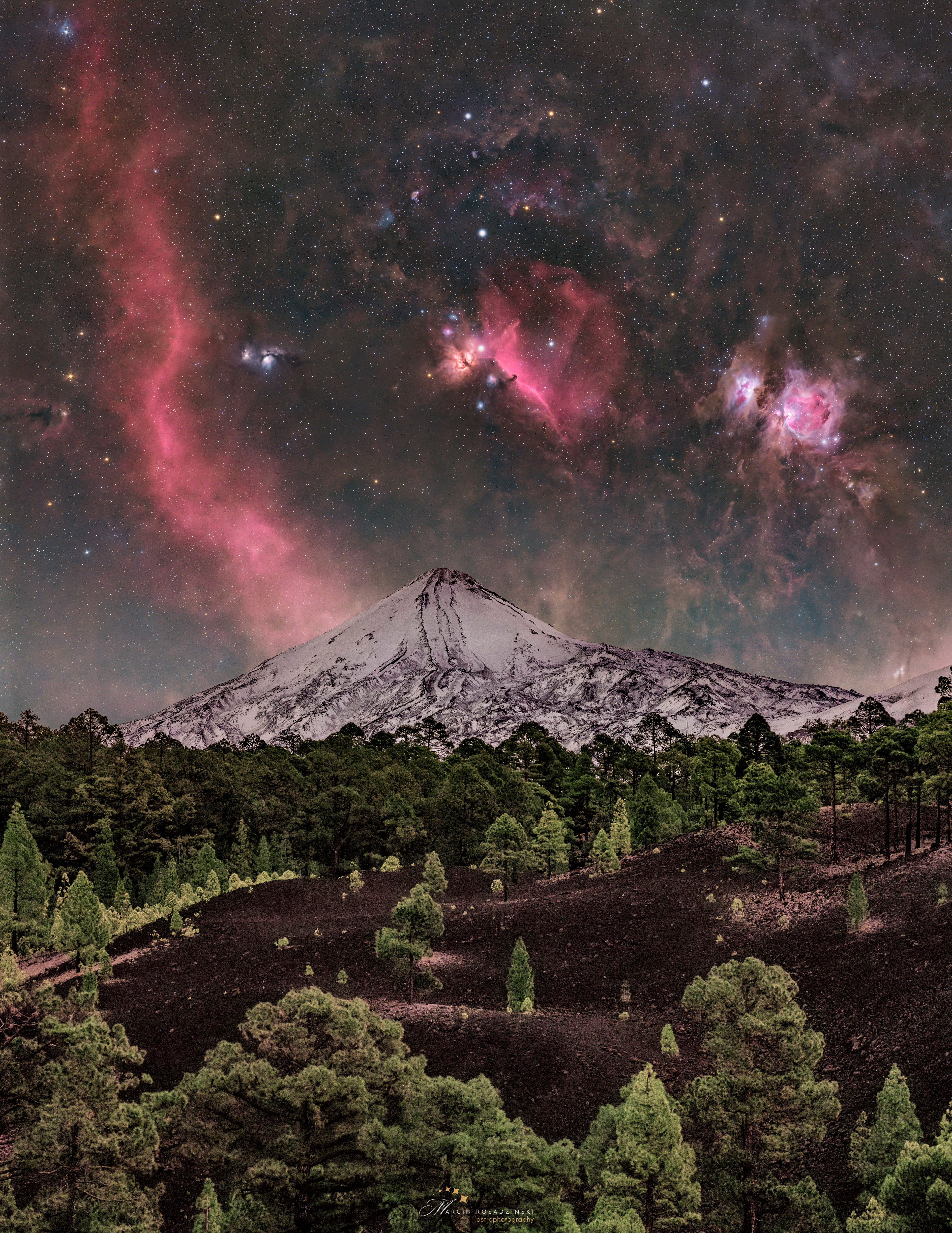 Orion is rarely seen like this.  To achieve this majestic vista, you need a camera capable of taking such long duration exposures that faint features in the night sky become revealed.  Iconic nebulas that appear include the Orion Nebula, the Flame Nebula, and Barnard's Loop. For contrast, it also helps to have a volcano on the foreground, in this case the Teide volcano on Tenerife on the Canary Islands of Spain.  But if you want your Teide volcano snow-covered, you also need good timing -- because that only happens, typically, for a few days each year.  Good timing also includes waiting for Orion to appear just behind Teide, which occurred late last year after sunset.  The featured image is the result of a series of images taken consecutively with the same camera from the same location.   Sky Surprise: What picture did APOD feature on your birthday? (after 1995)