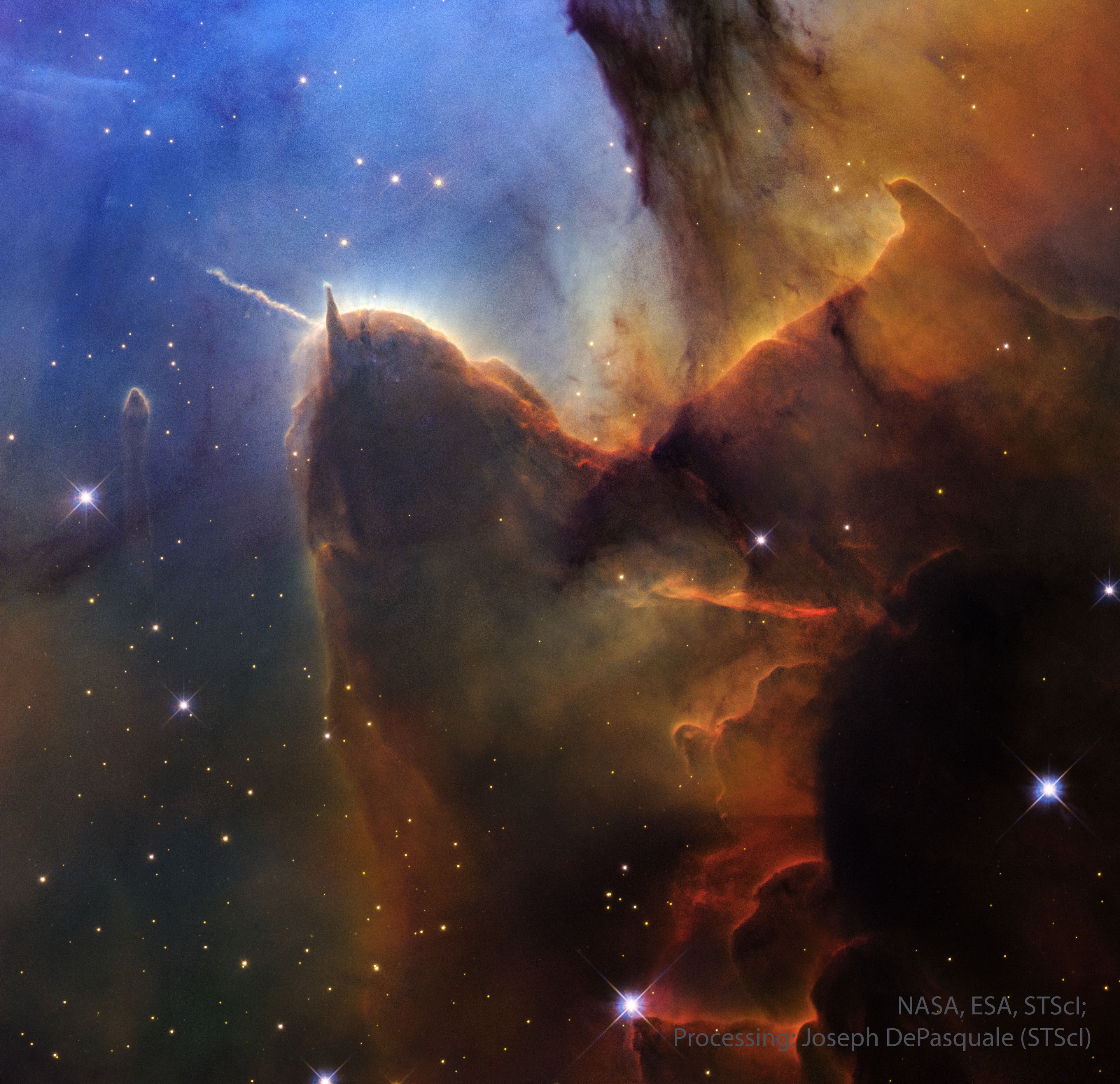 Dust pillars are like interstellar mountains.  They survive because they are more dense than their surroundings, but they are slowly being  eroded away by a hostile environment.  Visible in the featured picture by the Hubble Space Telescope is the end of a huge gas and dust pillar in the Trifid Nebula (M20), punctuated by a smaller pillar pointing up and an unusual jet pointing to the upper left.  Many of the bright dots are newly formed stars. A star near the small pillar's end is slowly being stripped of its accreting gas by radiation from a tremendously brighter star situated off the top of the image.  The jet extends nearly a light-year and would not be visible without external illumination.  As gas and dust evaporate from the pillars, the hidden stellar source of this jet will likely be uncovered, possibly over the next 20,000 years.   Explore the Universe: Random APOD Generator