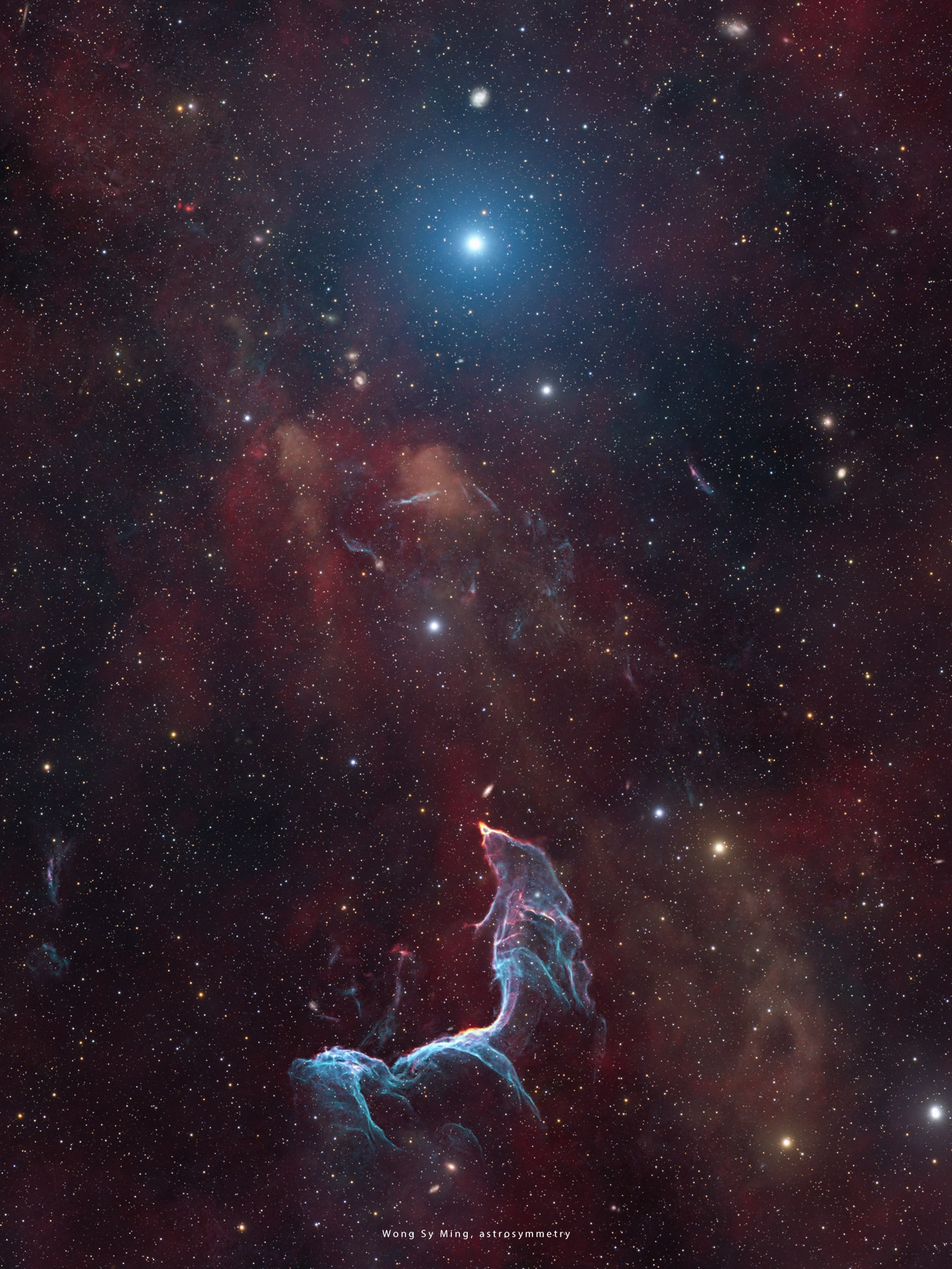Could the Little Mermaid turn into stardust instead of seafoam?   It would seem so in this beautiful nebula.   The featured image shows the Mermaid Nebula, also known as the Betta Fish Nebula, which is part of the G296.5+10.0 Supernova Remnant.   The blue color visible here originates from doubly ionized oxygen (OIII), while the deep red is emitted by hydrogen gas.   												 Estimated to be located a few thousand light-years away and about 10,000 years old, this nebula was formed when a massive star exploded as a supernova. 												 It left behind a peculiar pulsar, a young radio-quiet neutron star that spins around about twice every second.   The bright stars shown in the image are unassociated with the nebula.												   The pulsar can be detected in the X-rays but it does not have a confirmed detection in the optical (visible light) so far.   As a result, the pulsar itself is not visible in this image.