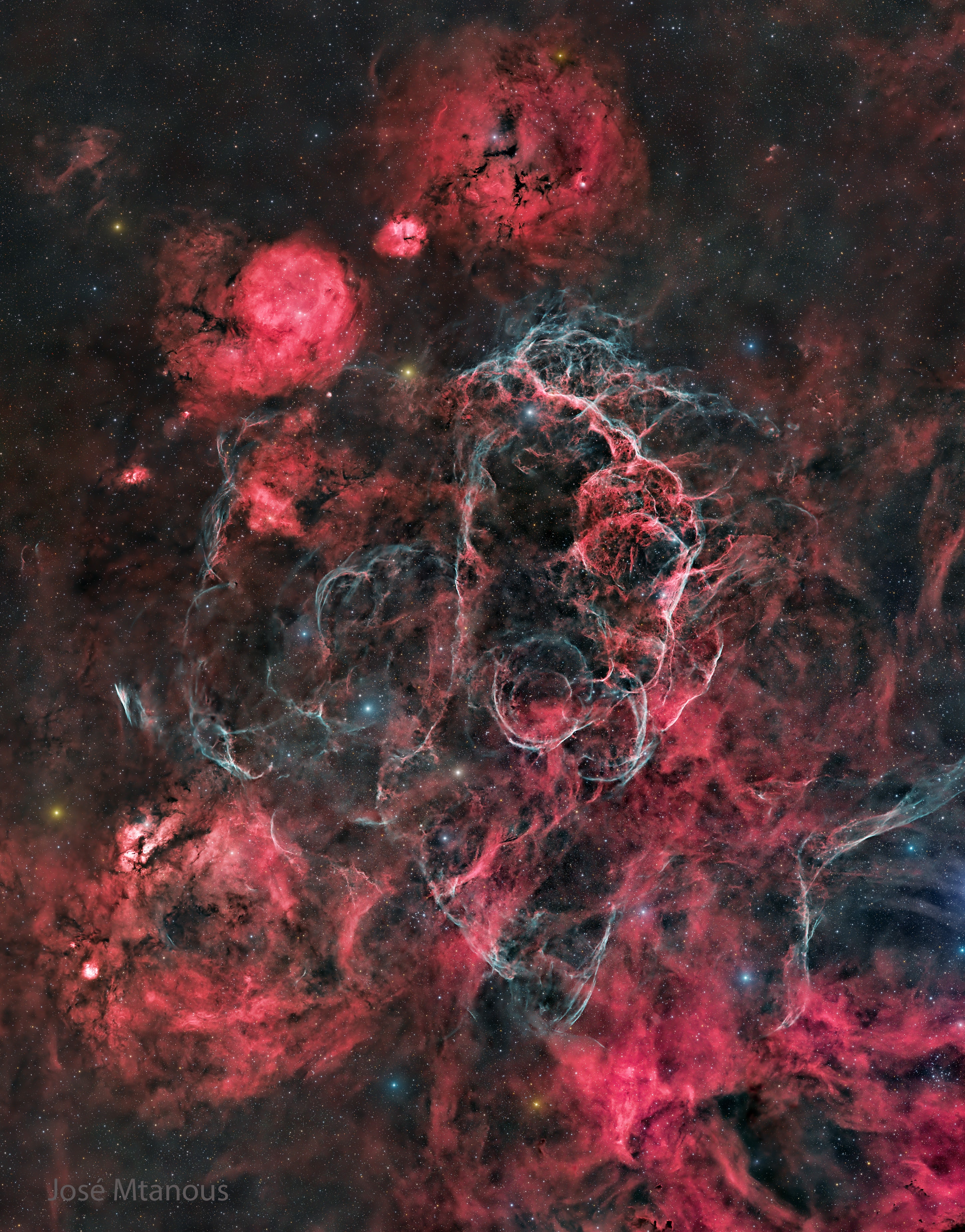 The explosion is over, but the consequences continue.  About twelve thousand years ago, a relatively normal star in the constellation Vela suddenly exploded, creating a strange point of light briefly visible to humans living near the beginning of recorded history.  The outer layers of the star crashed into the interstellar medium, driving a shock wave that is still visible today.  The featured image, taken piecemeal over 60 hours from the Khomas Region of Namibia, captures some of that filamentary and gigantic shock in visible light, with details highlighted by hydrogen (red) and oxygen (blue) emissions. As gas flies away from the detonated star, it decays and reacts with the interstellar medium, producing light in many different colors and energy bands. Remaining at the center of the Vela Supernova Remnant is a pulsar, a star as dense as nuclear matter that spins around more than ten times in a single second.   Explore the Universe: Random APOD Generator