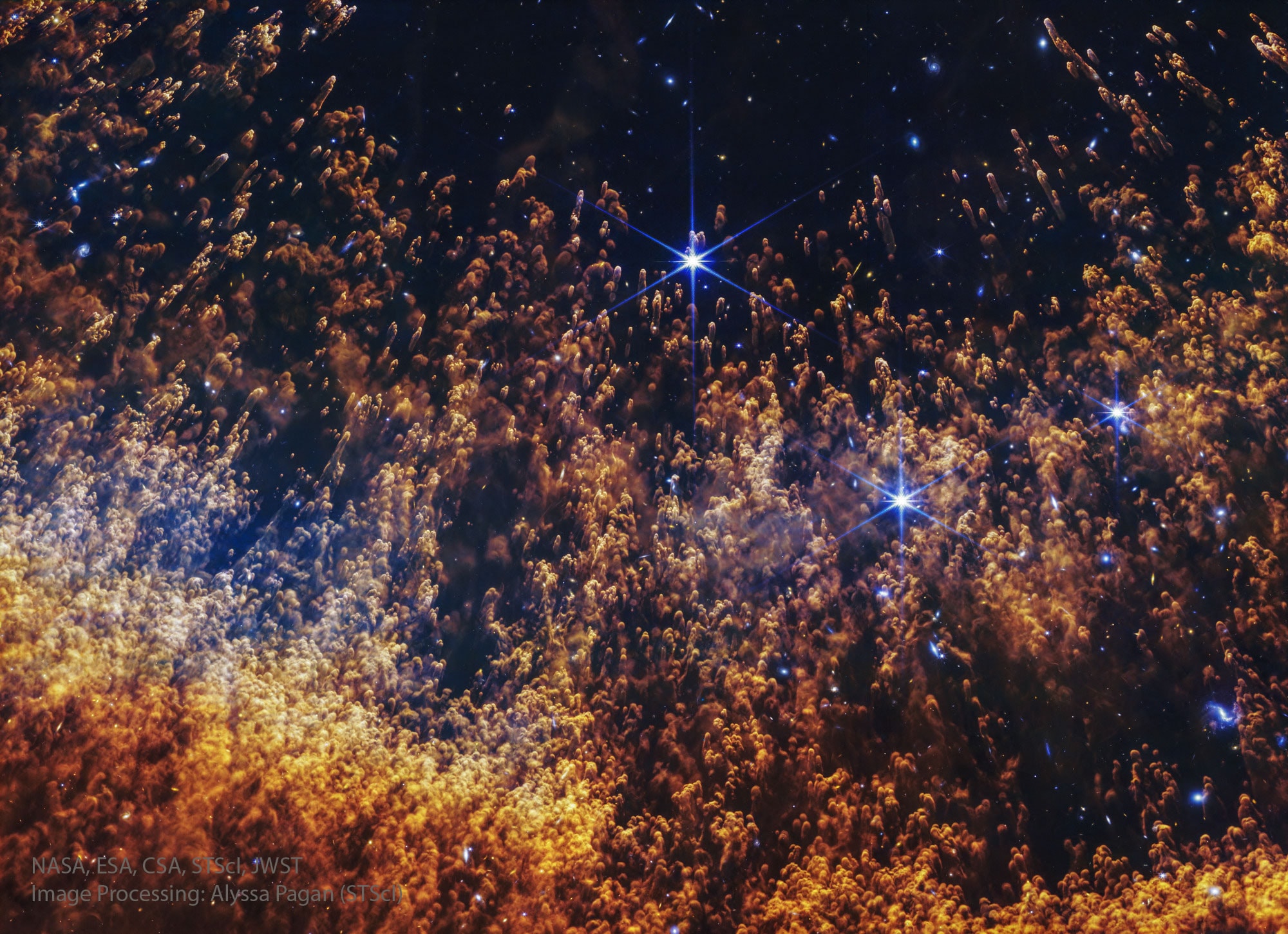 What causes unusual knots of gas and dust in planetary nebulas?  Seen also in the Ring Nebula, the Dumbbell Nebula and NGC 2392, the knots' existence was not initially predicted, and their origins are still not well understood.  Pictured here is a fascinating image of part of the Helix Nebula by the James Webb Space Telescope showing tremendous detail in infrared light. The cometary knots have masses similar to the Earth but have sizes typically several times the orbit of Pluto.  One hypothesis for the fragmentation and evolution of the knots includes existing gas being driven out by a less dense but highly energetic stellar wind of the central evolving star.  The Helix Nebula is one of the closest examples of a planetary nebula created at the end of the life of a Sun-like star.  Given a technical designation of NGC 7293, the Helix Nebula lies about 650 light-years away towards the constellation of Water Carrier (Aquarius).   Open Science: Browse 4,000+ codes in the Astrophysics Source Code Library
