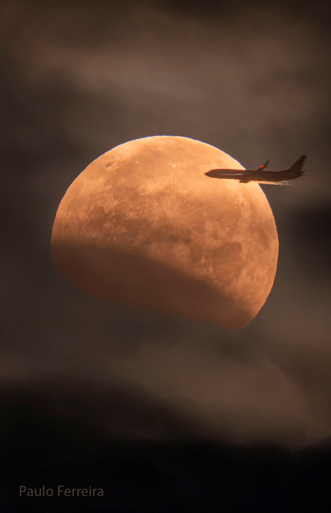 Did you need to be on the right side of this airplane to see this eclipse? No.  Lunar eclipses are routinely seen from the half of the Earth facing the Moon when the eclipse occurs, making them some of the most commonly witnessed astronomical events. You don't even need any special equipment to see one -- just your unaided eyes.  Lunar eclipses are also some of the most photographed astronomical events because, unlike with a solar eclipse, your eyes and camera do not have to look toward the bright Sun. However, considering the featured image taken last week from Portugal, if you were on the left side of that airplane during takeoff, you might have trouble seeing it -- at first. But even then, after takeoff, since lunar eclipses typically last for hours, you might soon be able to safely cross the aisle(s) to see it.   Gallery: Lunar Eclipse of 2026 August APOD's main NASA site is moving: From apod.nasa.gov to science.nasa.gov/apod