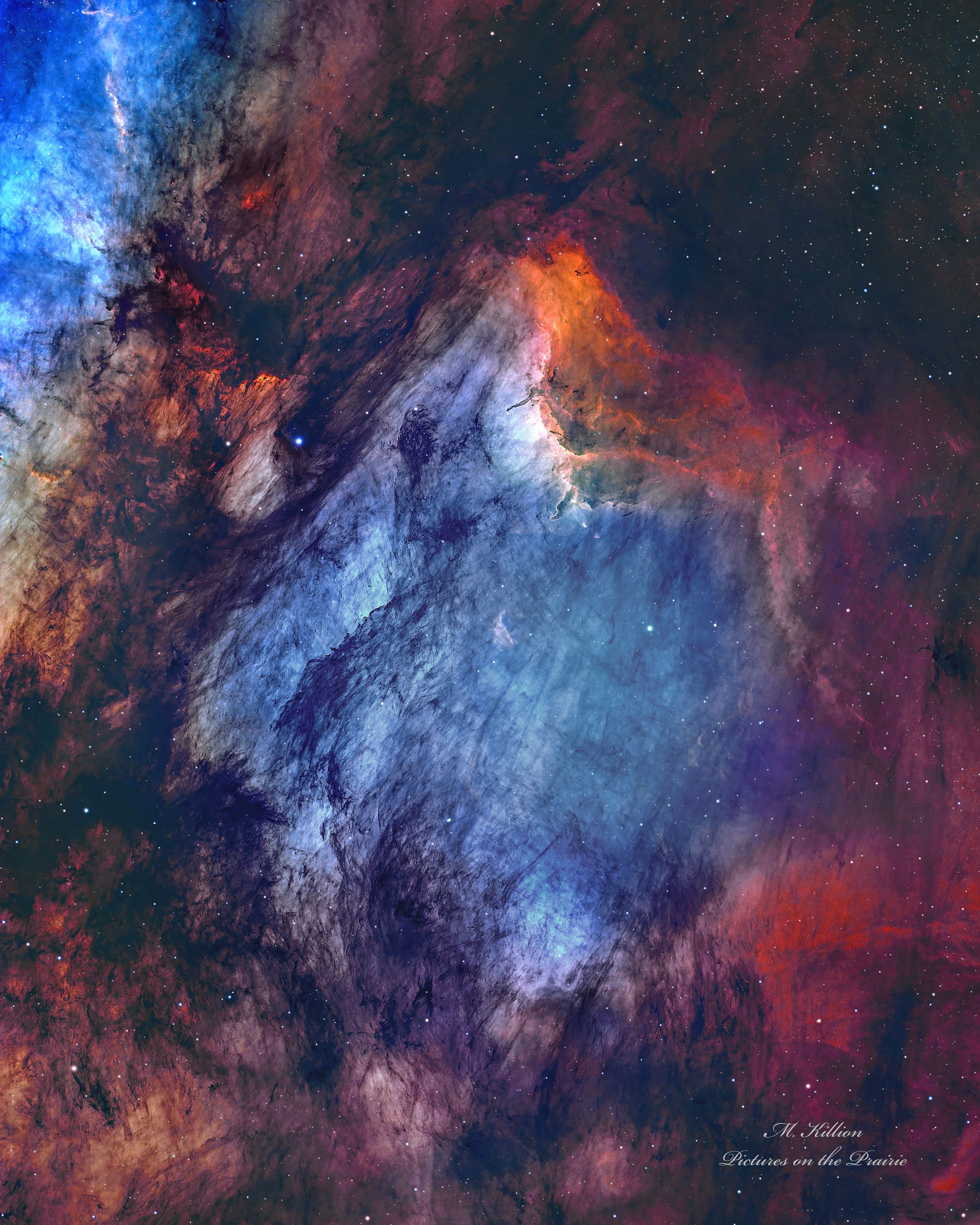 The Pelican Nebula is slowly being transformed.  IC 5070 (an official designation) is divided from the larger North America Nebula by a molecular cloud filled with dark dust.  The deep featured picture from Utah, USA incorporates 25 hours of exposure and brings out great details of this filamentary dust. The Pelican Nebula receives much study because it is a particularly active mix of star formation and evolving gas clouds.  The light from young energetic stars is slowly transforming the cold gas to hot gas, with the advancing boundary between the two, known as an ionization front, visible in bright orange on the upper right. Particularly dense tentacles of cold gas remain.  Millions of years from now, the Pelican Nebula, bounded by dark nebula LDN 935, might no longer be known as the Pelican, as the balance and placement of stars and gas will surely leave something that appears completely different.   APOD's main NASA site is moving: From apod.nasa.gov to science.nasa.gov/apod