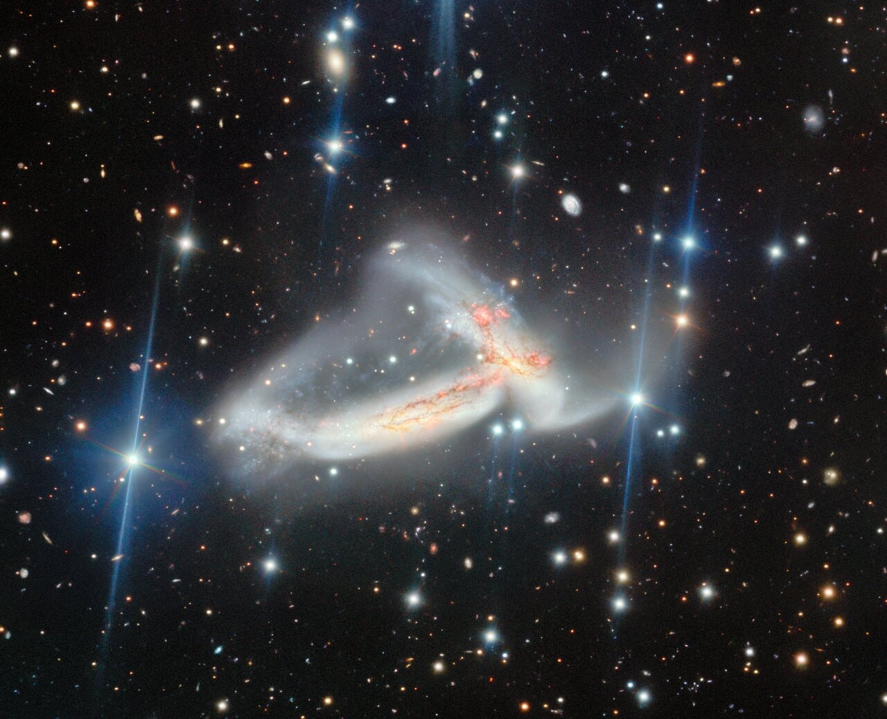 Nā ʻUhane Māhoe Huki Pū i ke Ola, is the Hawaiian name given to this image of a pair of spiral galaxies locked in a mutual gravitational embrace. Some 200 million light-years distant toward the high flying constellation Pegasus their spectacular, galactic scale merger is captured in sharp detail in the image from the 8.1 meter Gemini North telescope on Maunakea, Hawai‘i. The galaxy pair, known as NGC 7253 and Arp 278, was chosen as a target, researched, and given a Hawaiian name by high school students in the joint Gemini Observatory and University of Hawaiʻi Project Hōkūlani internship program.  The name translates to "The Twin Spirits Pulling Together Creating Life". That's both culturally and astronomically appropriate for galaxy collisions that trigger a cosmic maelstrom of star formation from galactic reservoirs of elemental building blocks of life. These merging galaxies are found within a region of Pegasus identified as the Hawaiian navigational constellation Ka Lupe o Kawelo.  APOD's main NASA site is moving: From apod.nasa.gov to science.nasa.gov/apod