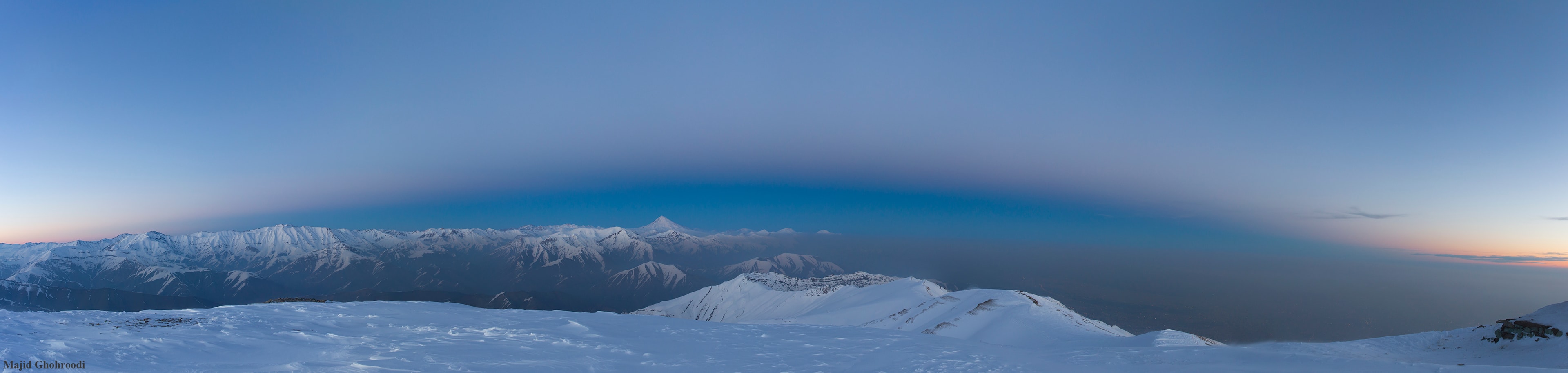 Through crystal clear skies this beautiful panorama follows the curve of planet Earth's shadow rising across the top of the world. The tantalizing twilight view is composed of eight single frames captured from 4,000 meters above sea level at sunset on April 6. Just above the dark grey Earth-shadow boundary lies a fading, pinkish, anti-twilight arch. Also known as the belt of Venus, its reddened and back-scattered sunlight finally merges with the still blue eastern sky. Standing tall near center along the rugged horizon line is the distant sharp peak of Mount Damavand in the snowy Alborz mountains. A feature in Persian mythology and literature, Damavand is a stratovolcano reaching 5,610 meters above sea level, the highest peak in Iran and the Middle East.