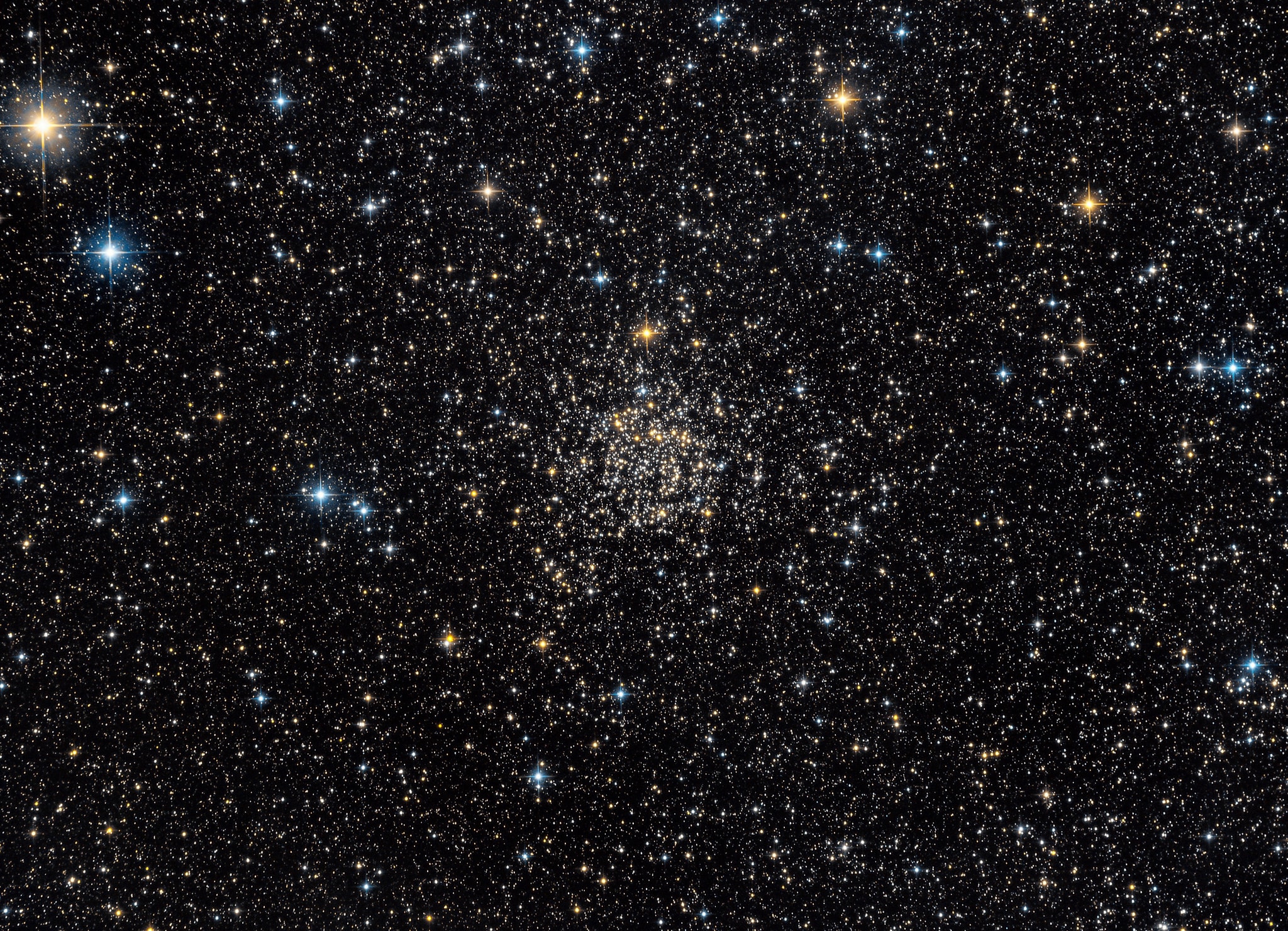 Found among the rich starfields of the Milky Way, star cluster NGC 7789 lies about 8,000 light-years away toward the constellation Cassiopeia. A late 18th century deep sky discovery of astronomer Caroline Lucretia Herschel, the cluster is also known as Caroline's Rose. Its flowery visual appearance in small telescopes is created by the cluster's nestled complex of stars and voids. Now estimated to be 1.6 billion years young, the galactic or open cluster of stars also shows its age. All the stars in the cluster were likely born at the same time, but the brighter and more massive ones have more rapidly exhausted the hydrogen fuel in their cores. These have evolved from main sequence stars like the Sun into the many red giant stars shown with a yellowish cast in this lovely color composite. Using measured color and brightness, astronomers can model the mass and hence the age of the cluster stars just starting to "turn off" the main sequence and become red giants. Over 50 light-years across, Caroline's Rose spans about half a degree (the angular size of the Moon) near the center of the wide-field telescopic image.