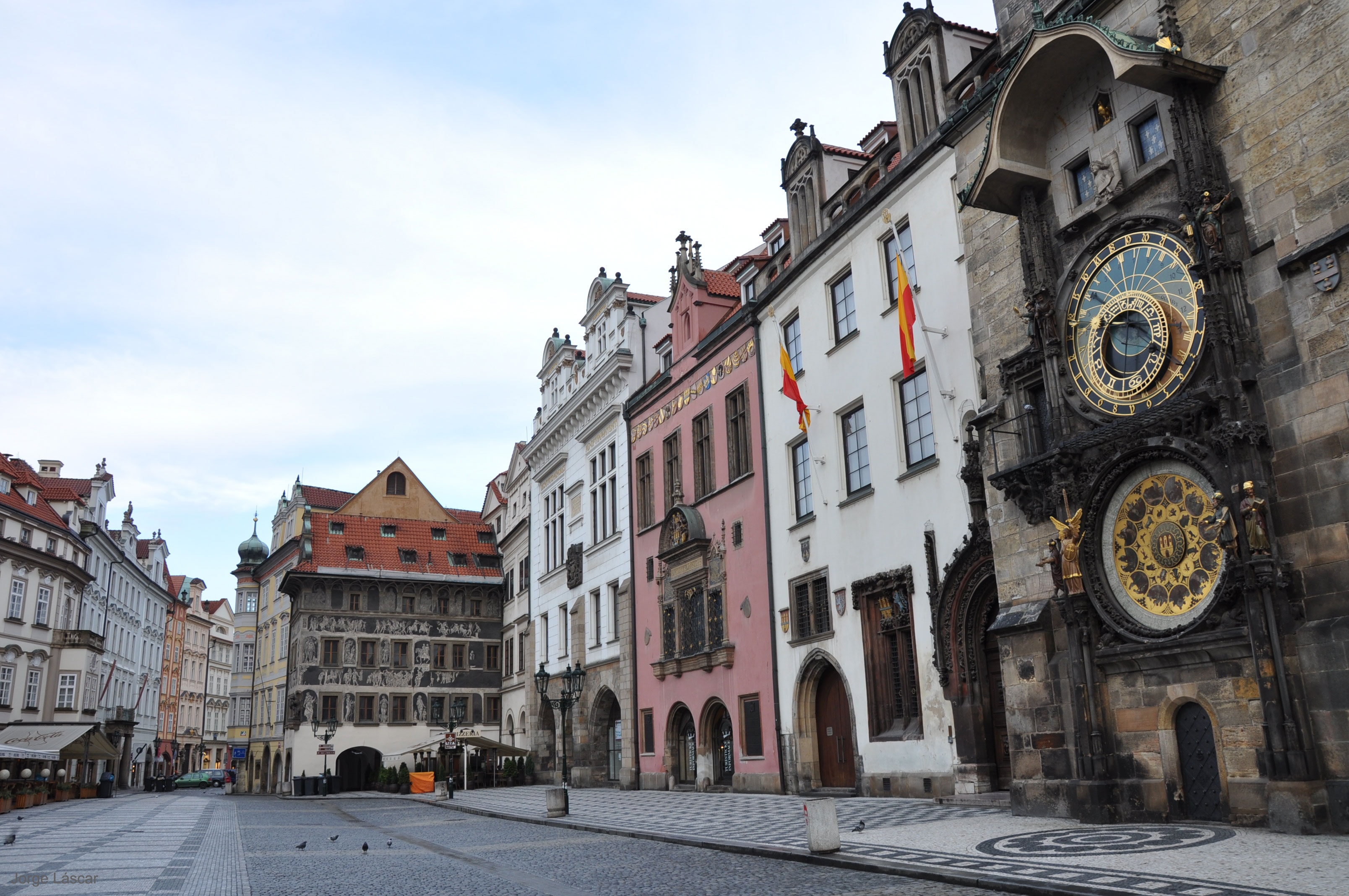 In the center of Prague there's a clock the size of a building. During the day, crowds gather to watch the show when it chimes in a new hour. The Prague Astronomical Clock's face is impressively complex, giving not only the expected time with respect to the Sun (solar time), but the time relative to the stars (sidereal time), the times of sunrise and sunset at several latitudes including the equator, the phase of the Moon, and much more. The clock began operation in 1410, and even though much of its inner workings have been modernized several times, original parts remain. Below the clock is a nearly-equal sized solar calendar that rotates only once a year. Pictured, the Prague Astronomical Clock was photographed alone during an early morning in 2009 March. The Prague Astronomical Clock and the Old Town Tower behind it are currently being renovated once again, with the clock expected to be restarted in 2018 June.