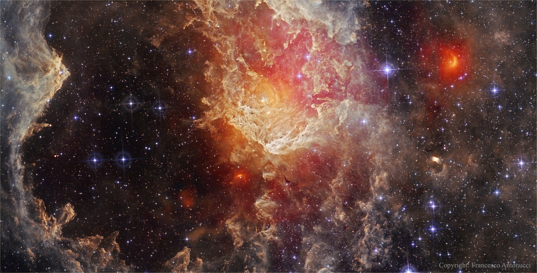 Young stars themselves are clearing out their nursery in NGC 7822. Within the nebula, bright edges and complex dust sculptures dominate this detailed skyscape taken in infrared light by NASA's Wide Field Infrared Survey Explorer (WISE) satellite. NGC 7822 lies at the edge of a giant molecular cloud toward the northern constellation Cepheus, a glowing star forming region that lies about 3,000 light-years away. The atomic emission of light by the nebula's gas is powered by energetic radiation from the hot stars, whose powerful winds and light also sculpt and erode the denser pillar shapes. Stars could still be forming inside the pillars by gravitational collapse, but as the pillars are eroded away, any forming stars will ultimately be cut off from their reservoir of star stuff. This field spans around 40 light-years at the estimated distance of NGC 7822. Free APOD Lectures: January 5 in NYC & January 9 in DC